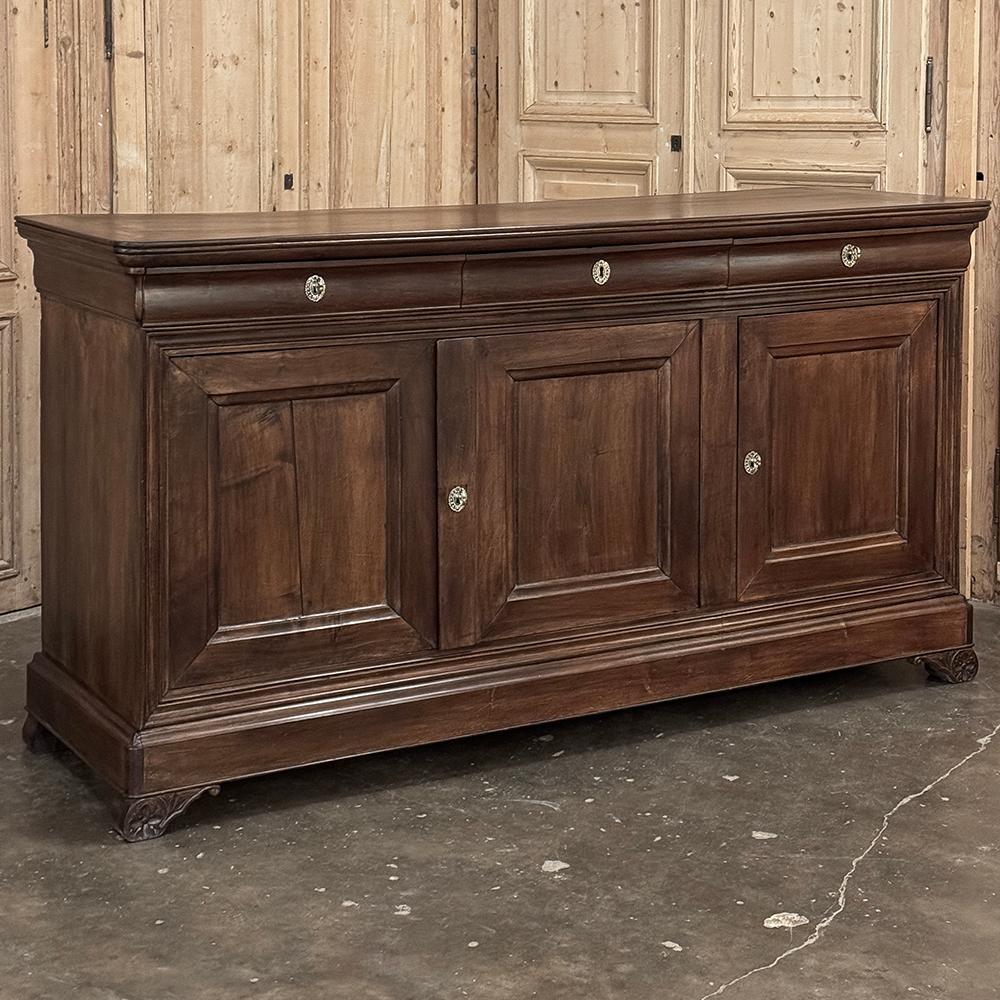 19th Century French Louis Philippe Period Cherry Wood Buffet features the restrained elegance that is definitive of both the era and the style itself.  Hand-crafted on a bit larger scale than is typical, this wonderful example nevertheless retains