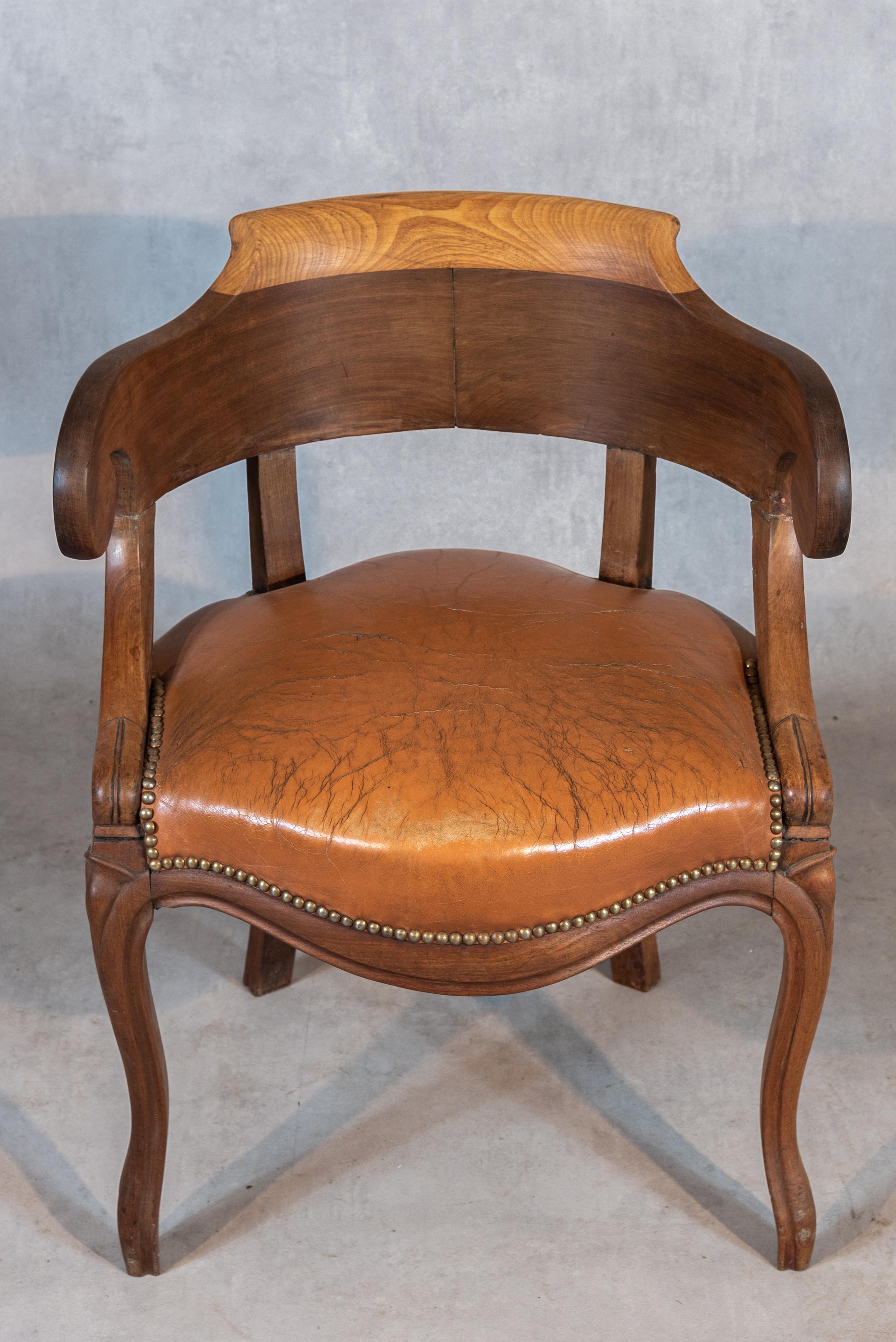Indulge in the timeless elegance of the 19th century with this exquisite French Mahogany Louis Philippe Period Desk Chair. Crafted with meticulous attention to detail, this chair embodies the sophistication and charm of the Louis Philippe