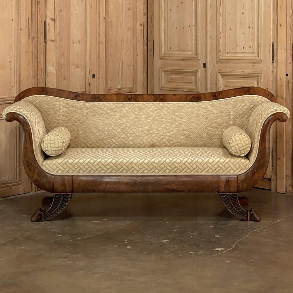 19th Century French Louis Philippe Period Mahogany sofa was hand-crafted during the first half of the century with style elements that were in a constant state of flux at the time. The elegantly scrolled form represents the essence of the French