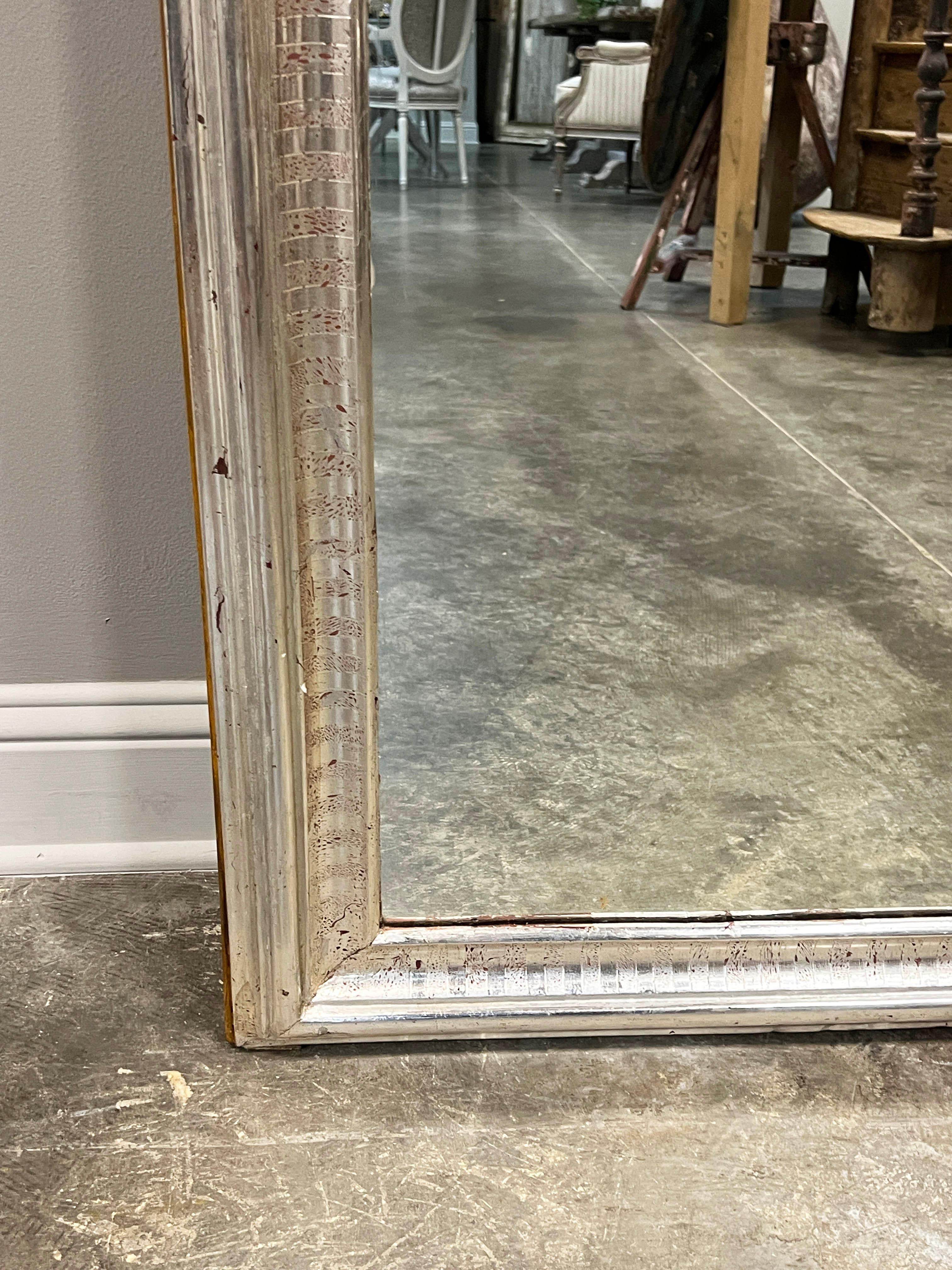 19th C. French Louis Philippe style silver gilt mirror, striped design on the frame, original glass and beautiful patina.