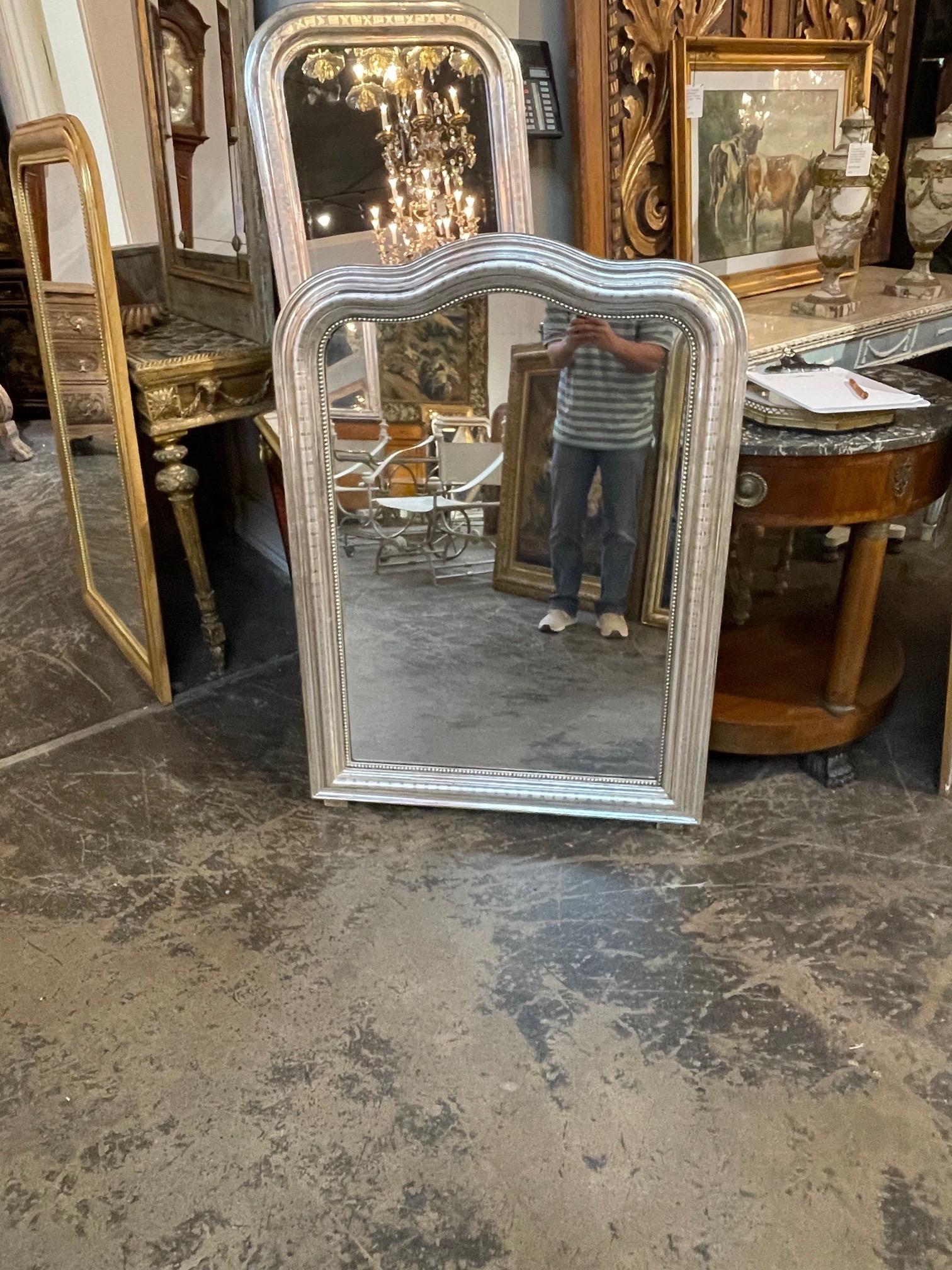 Beautiful 19th century French Louis Philippe silver leaf arch top mirror. Featuring a nice bar pattern and a beaded inner border. Fabulous!