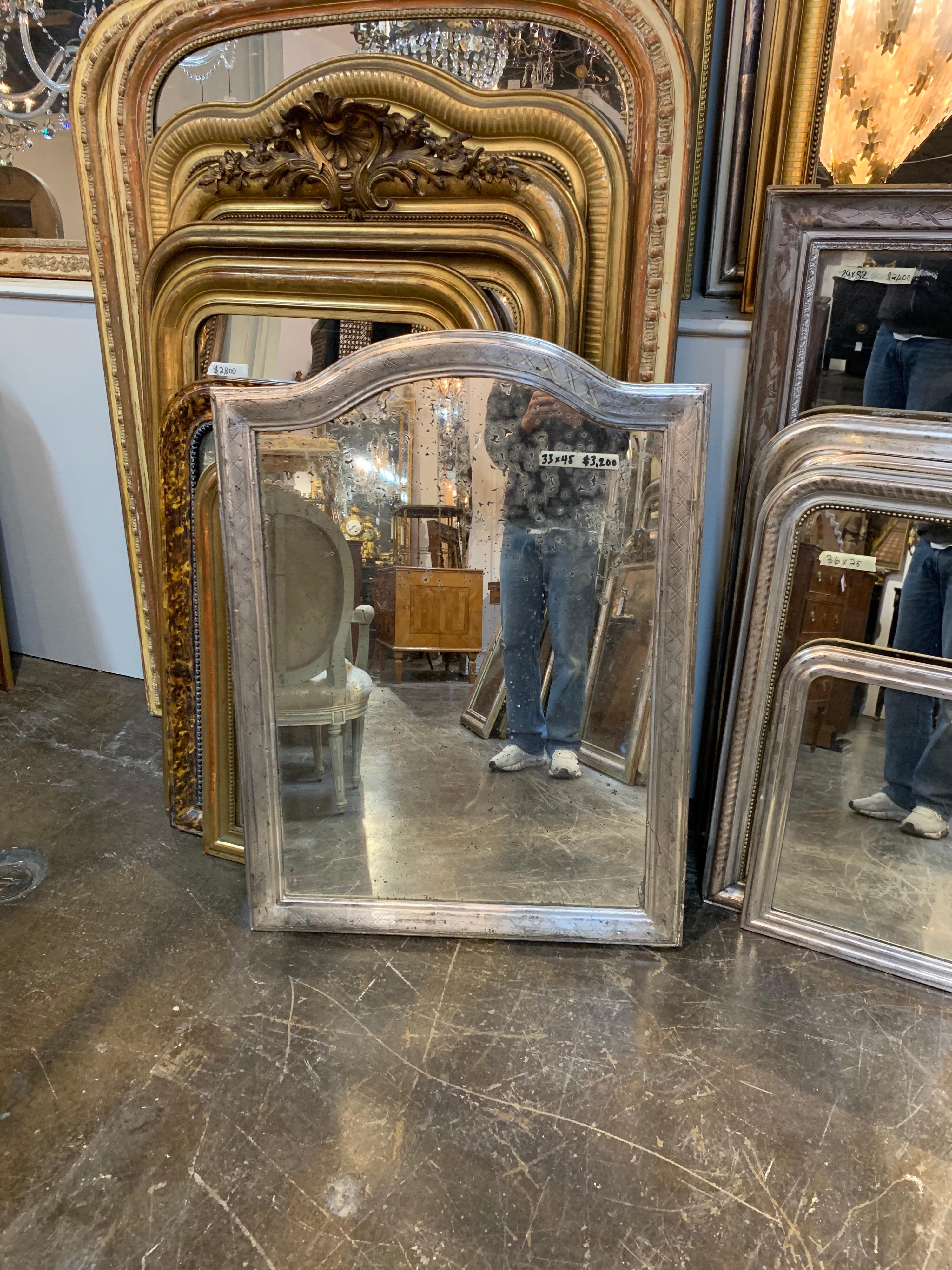 Beautiful 19th century French Louis Philippe silver leaf mirror. The mirror has arched top and an X-form pattern. The glass is also original very nice!