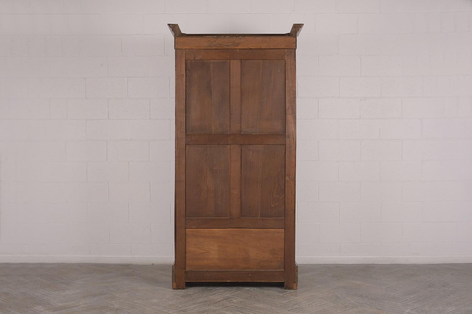 This 1890s single door bookcase is ready for any office or home space. Made from solid walnut wood, with a bevelled crown, single wood moulding frame and original clear glass door. Features four fully adjustable wood shelves, and one single drawer