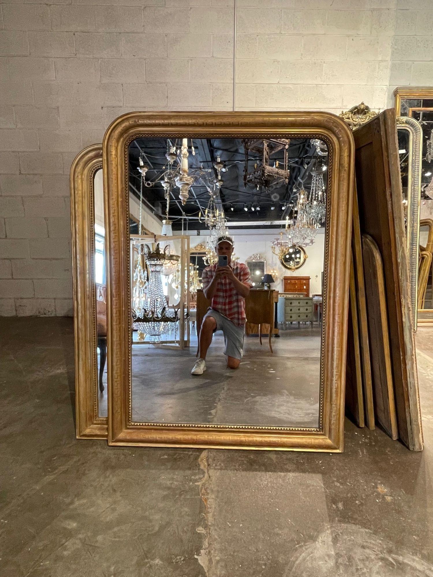 Exceptional large 19th century French Louis Philippe style giltwood mirror with decorative Greek key pattern. Very fine patina with slight red undertones and beaded inner border. Beautiful!!