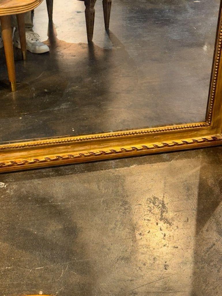 XIXe siècle Miroir Louis Philippe du 19ème siècle en bois doré transitionnel français en vente