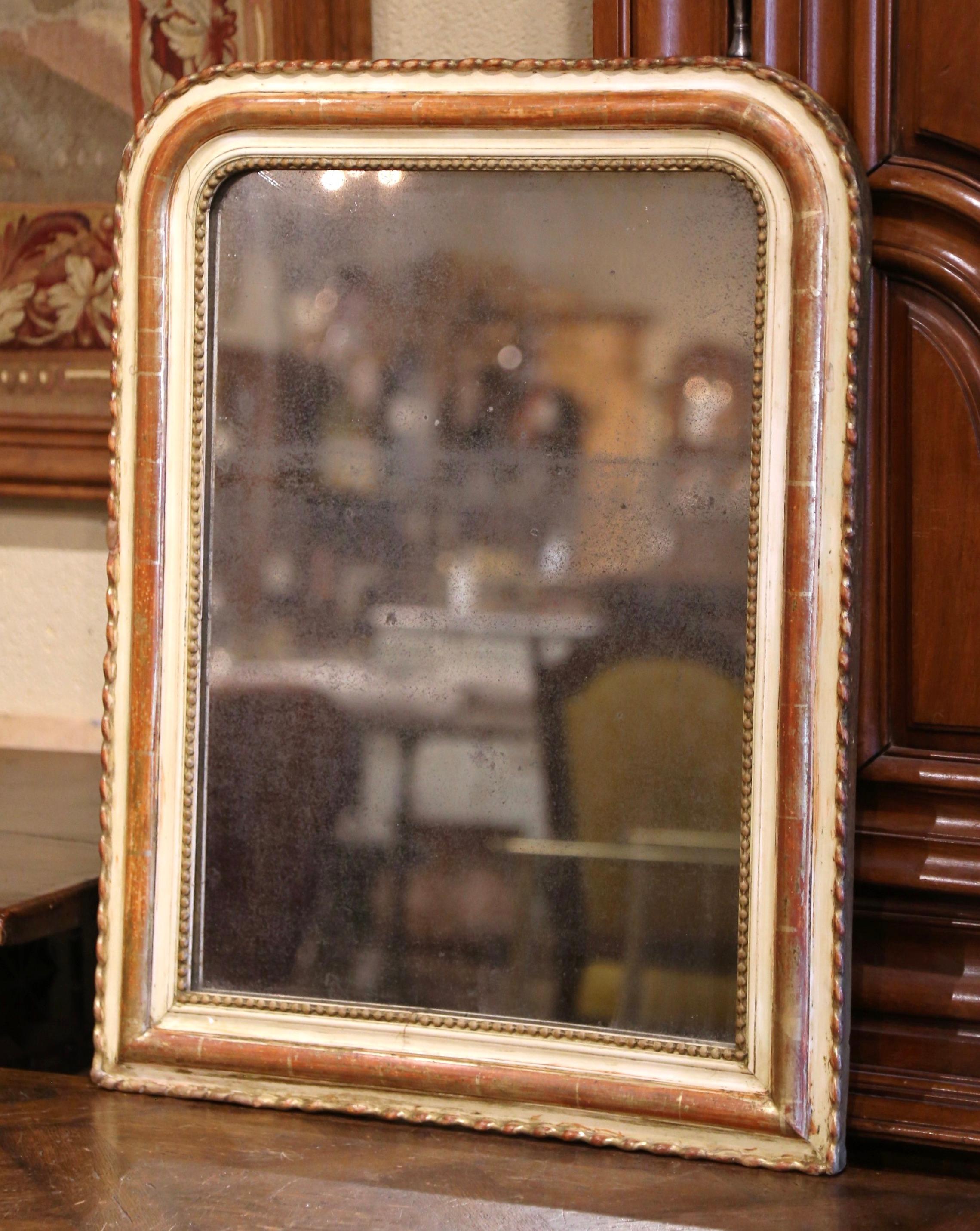 Decorate an entry or a powder room with this elegant, antique mirror. Crafted in France, circa 1860, the rectangular wall piece has rounded corners and is embellished with decorative beads around the frame. The traditional Louis Philippe frame