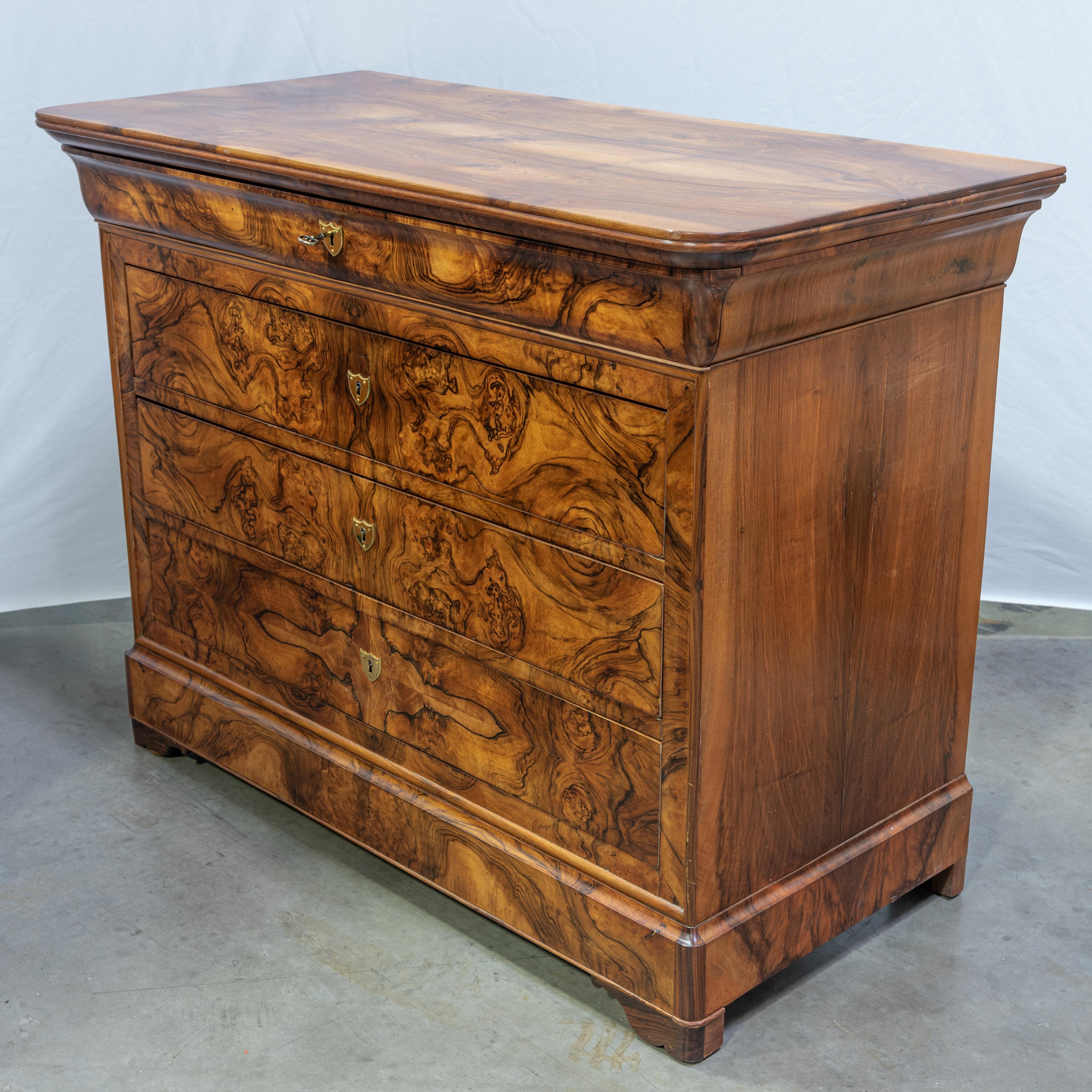 Behold the timeless elegance of this 19th Century French Louis Philippe Commode, a masterpiece of the period that exudes sophistication and charm. Crafted with exquisite attention to detail, this commode features four spacious drawers adorned with