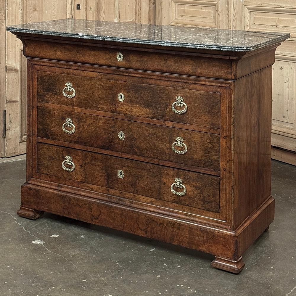 19th Century French Louis Philippe Walnut Marble Top Commode is a fine example of late period craftsmanship, when additional ornamentation was beginning to be introduced.  The ornamentation takes the form of finely detailed brass castings forming