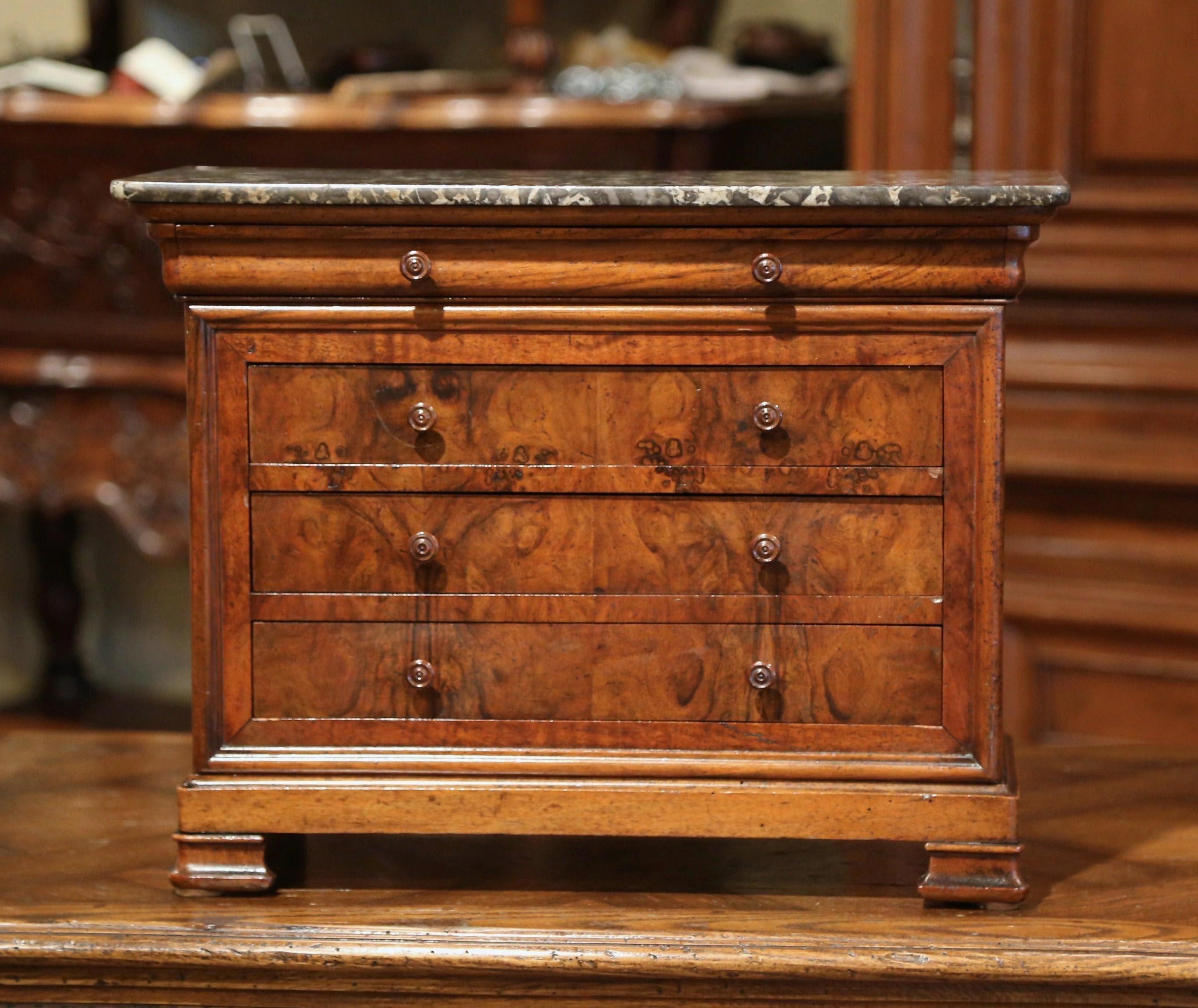 Decorate a master bathroom counter with this miniature chest of drawers. Crafted in France circa 1890, the petite fruitwood 