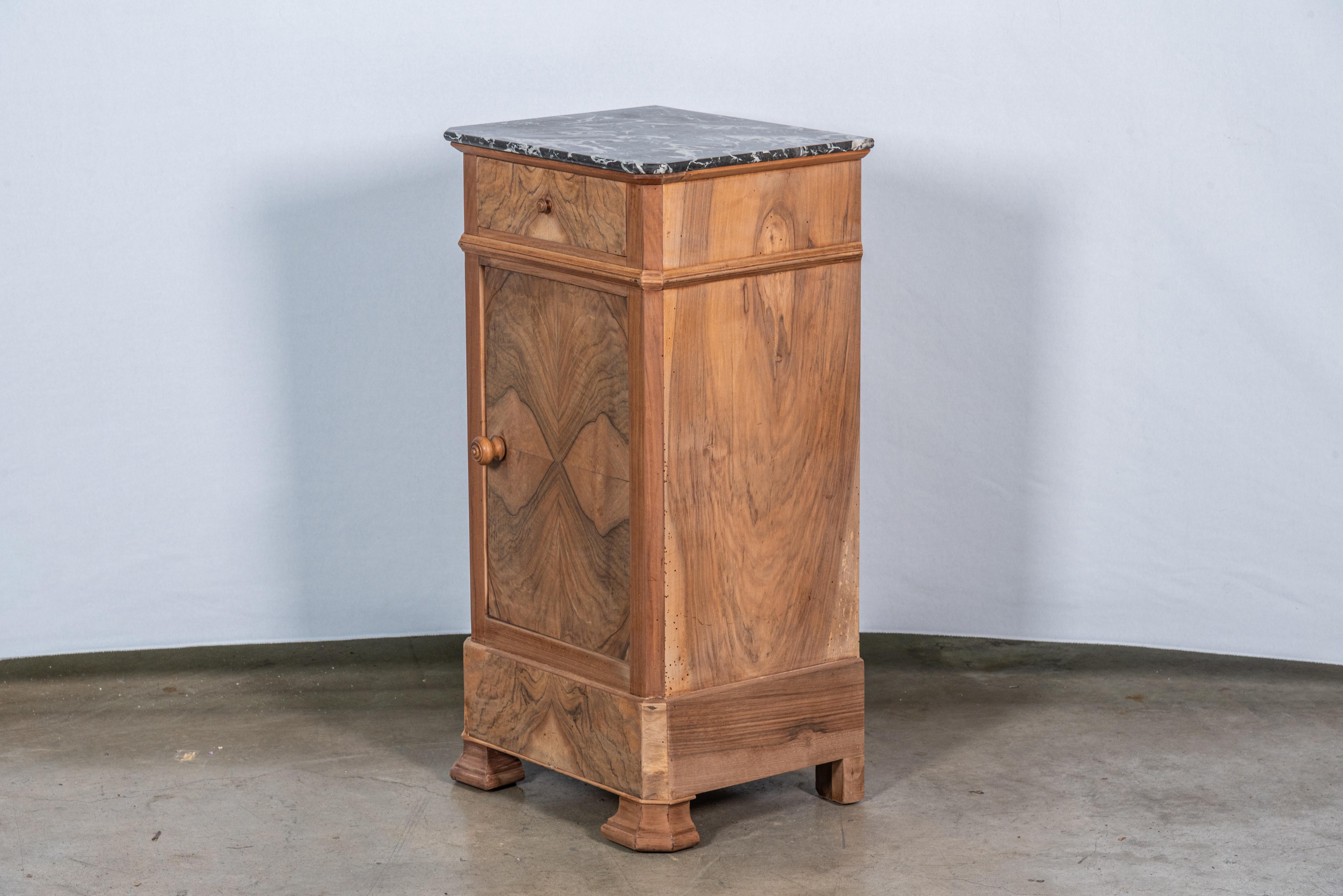 Discover timeless elegance with our 19th Century French Louis Philippe Walnut Nightstand, boasting exquisite craftsmanship and classic design. Crafted from premium walnut wood and adorned with a lustrous walnut veneer, this nightstand exudes