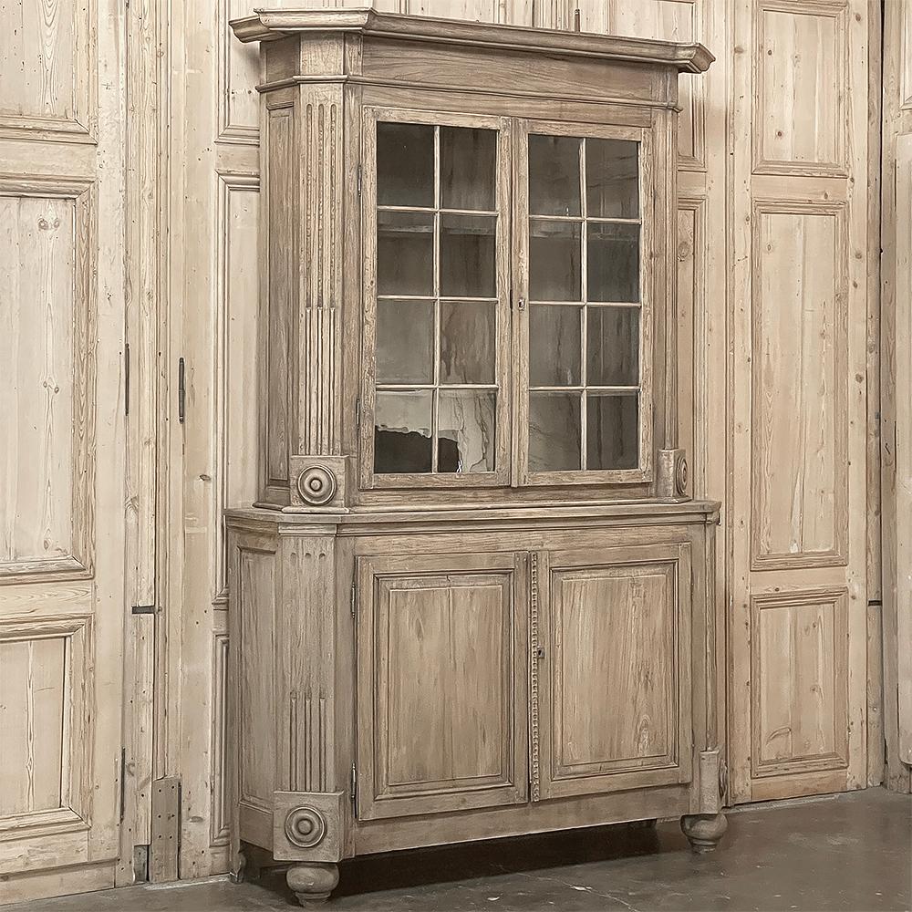 19th Century French Louis XIII Bookcase in Stripped Oak is a majestic reminder of the glorious revivals of designs spanning millennia that occurred during the middle to the end of the 1800s in France.  Hand-crafted from dense, old-growth quarter