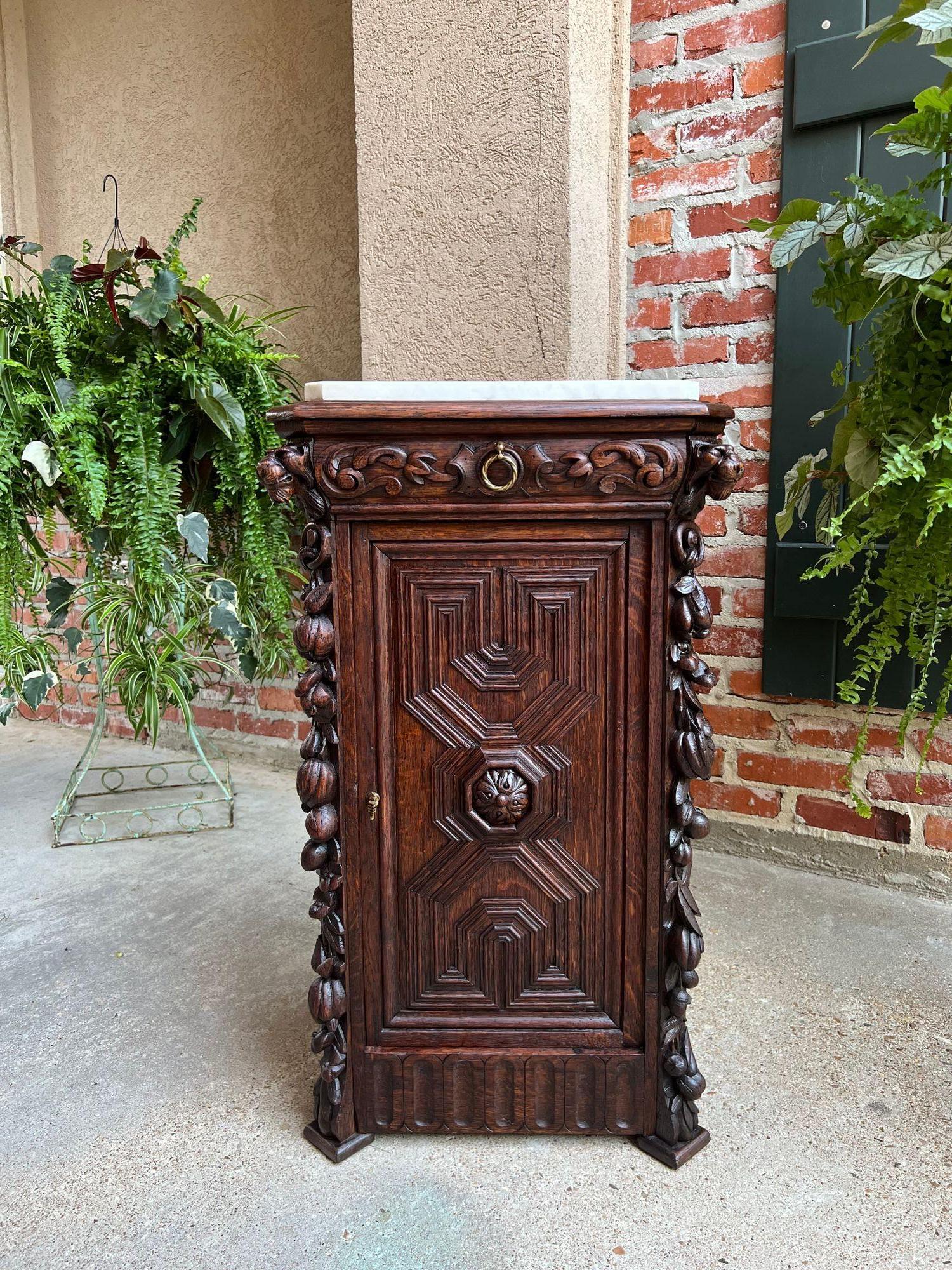 19th century Antique French Louis XIII Cabinet Pedestal Table White Marble Carved Oak.
 
Direct from France, a stunning 19th century French octagon pedestal cabinet.
Elaborately carved on ALL sides, perfect to place in the centre of a room, with a