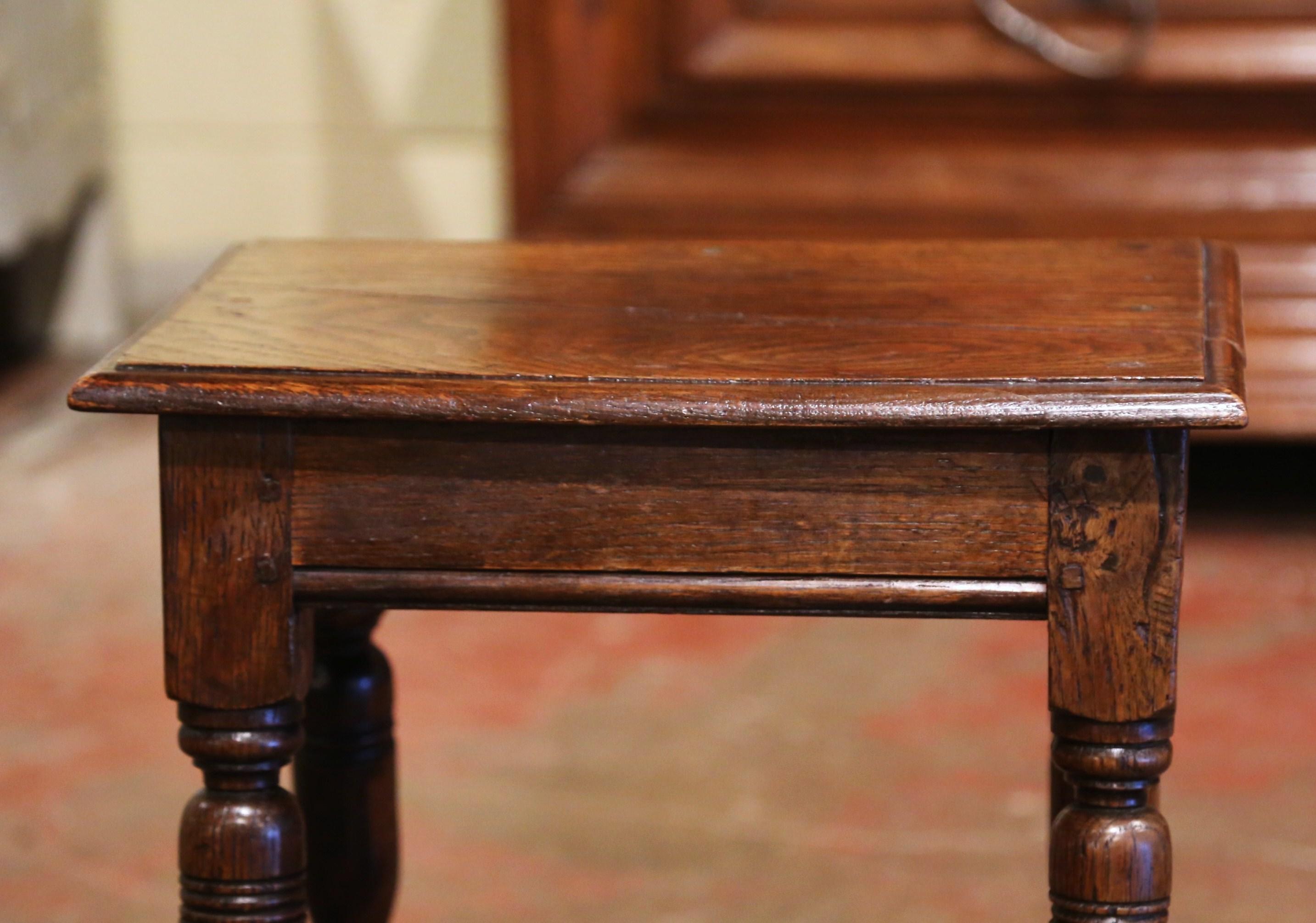 This elegant antique stool was created in Northern France, circa 1880. Built of chestnut and rectangular in shape, the piece stands on four turned legs connected with a sturdy stretcher at the bottom. The rustic stool is in excellent condition with