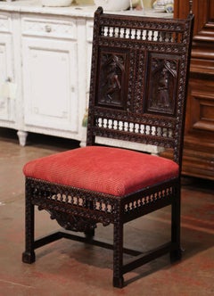 19th Century French Breton Carved Oak Chair with Red Upholstered Seat