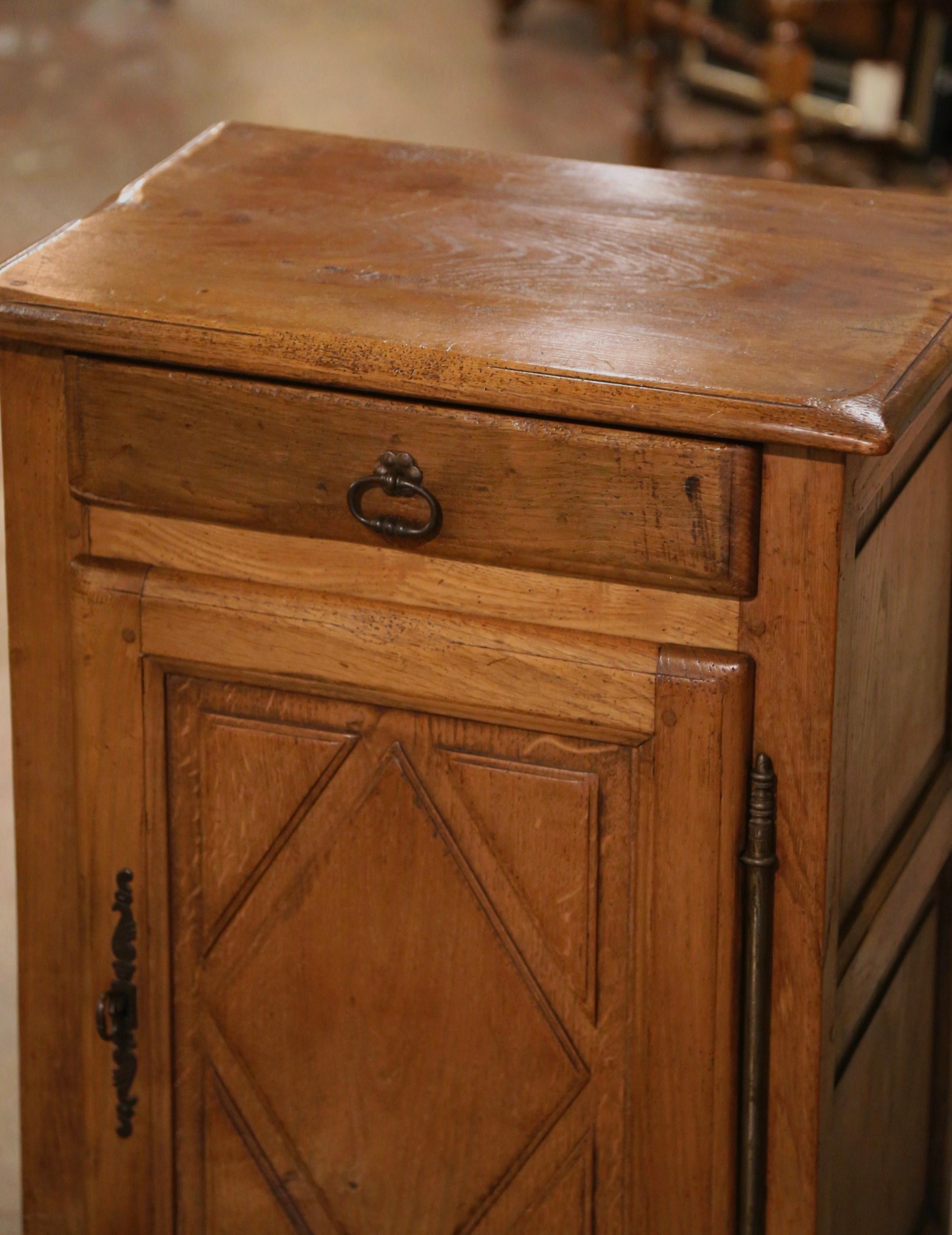 This antique jelly cabinet was crafted in Normandy, France, circa 1880. Made of oak wood and standing on straight legs over a straight apron, the 