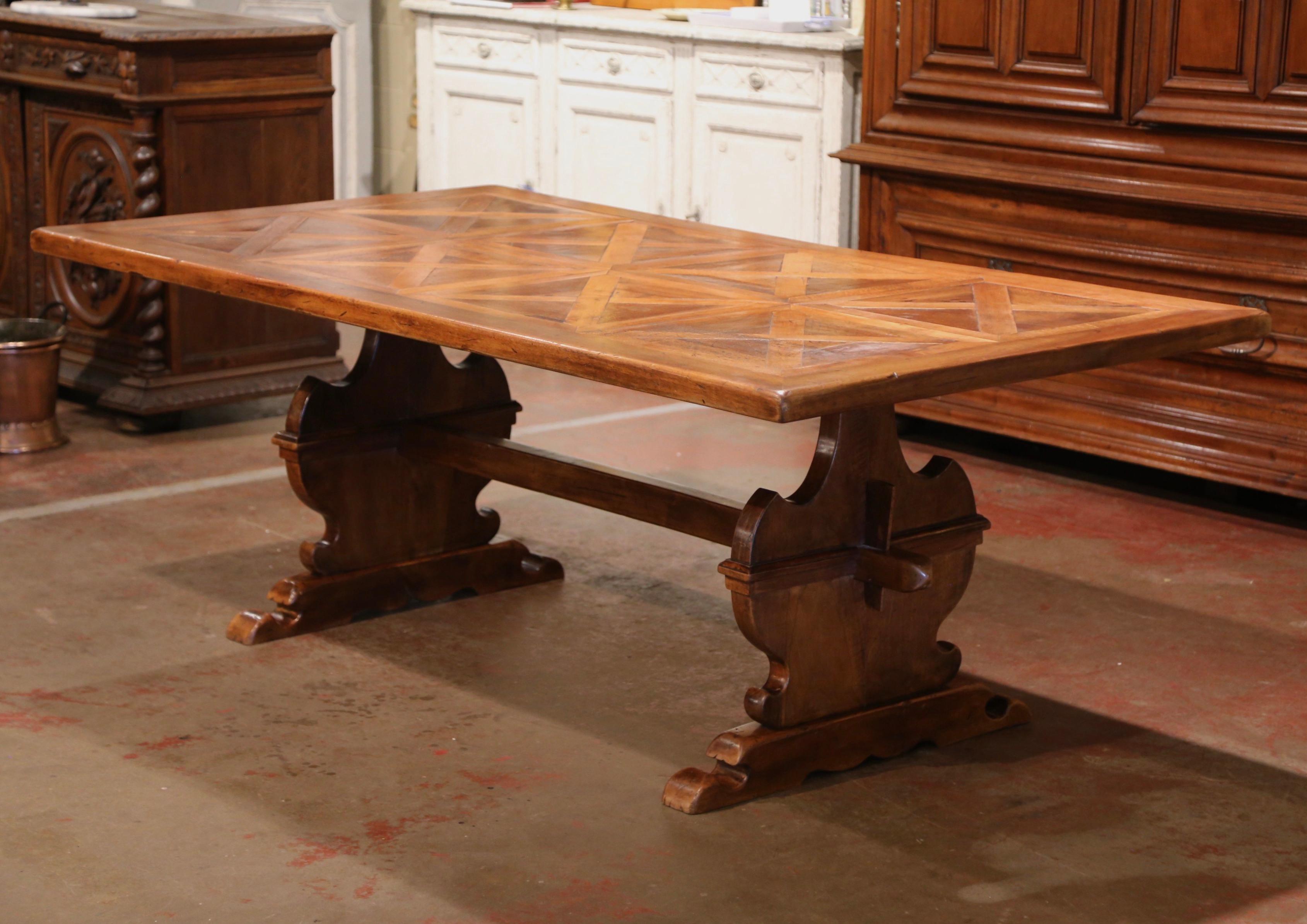 Bring the old world look into your dining or breakfast room with this elegant antique table. Crafted in France circa 1860, the table stands on two hand carved supports ending with a molded shoe base, and connected with a thick central stretcher. The