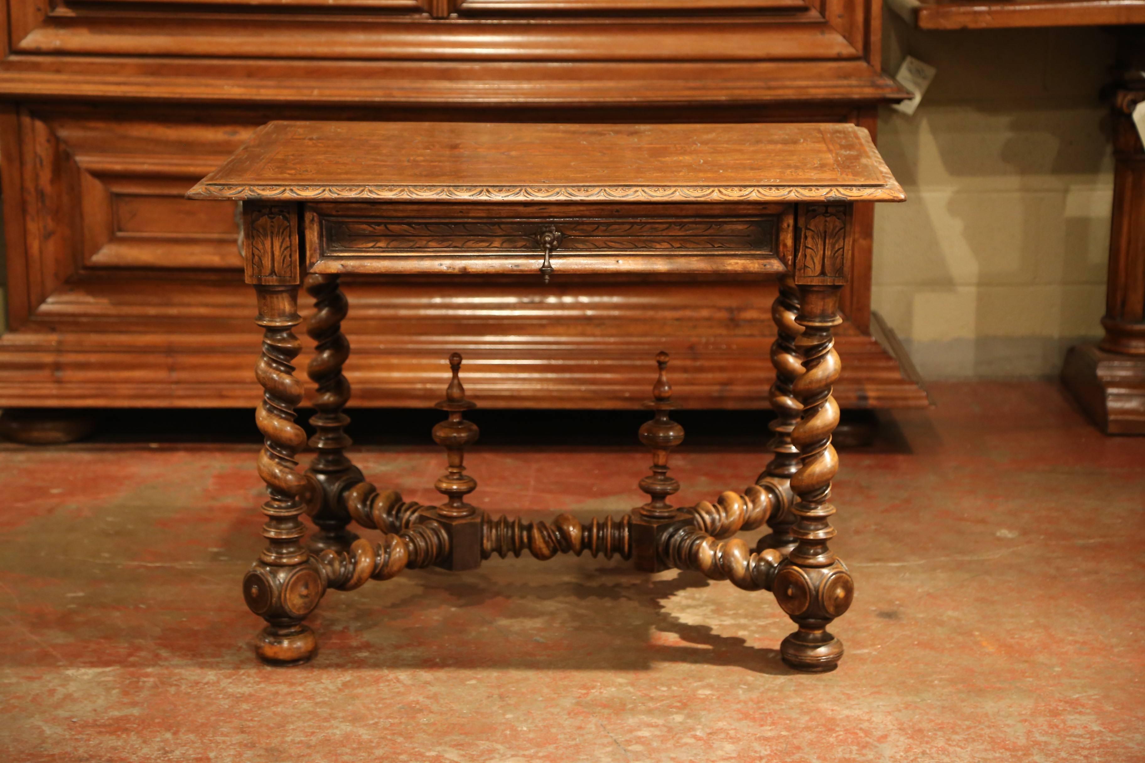 Incorporate extra, functional surface space into your living room with this elegant fruitwood end table. Crafted in the Perigord region of France circa 1860, this small desk features an unusual engraved surface top with decorations including