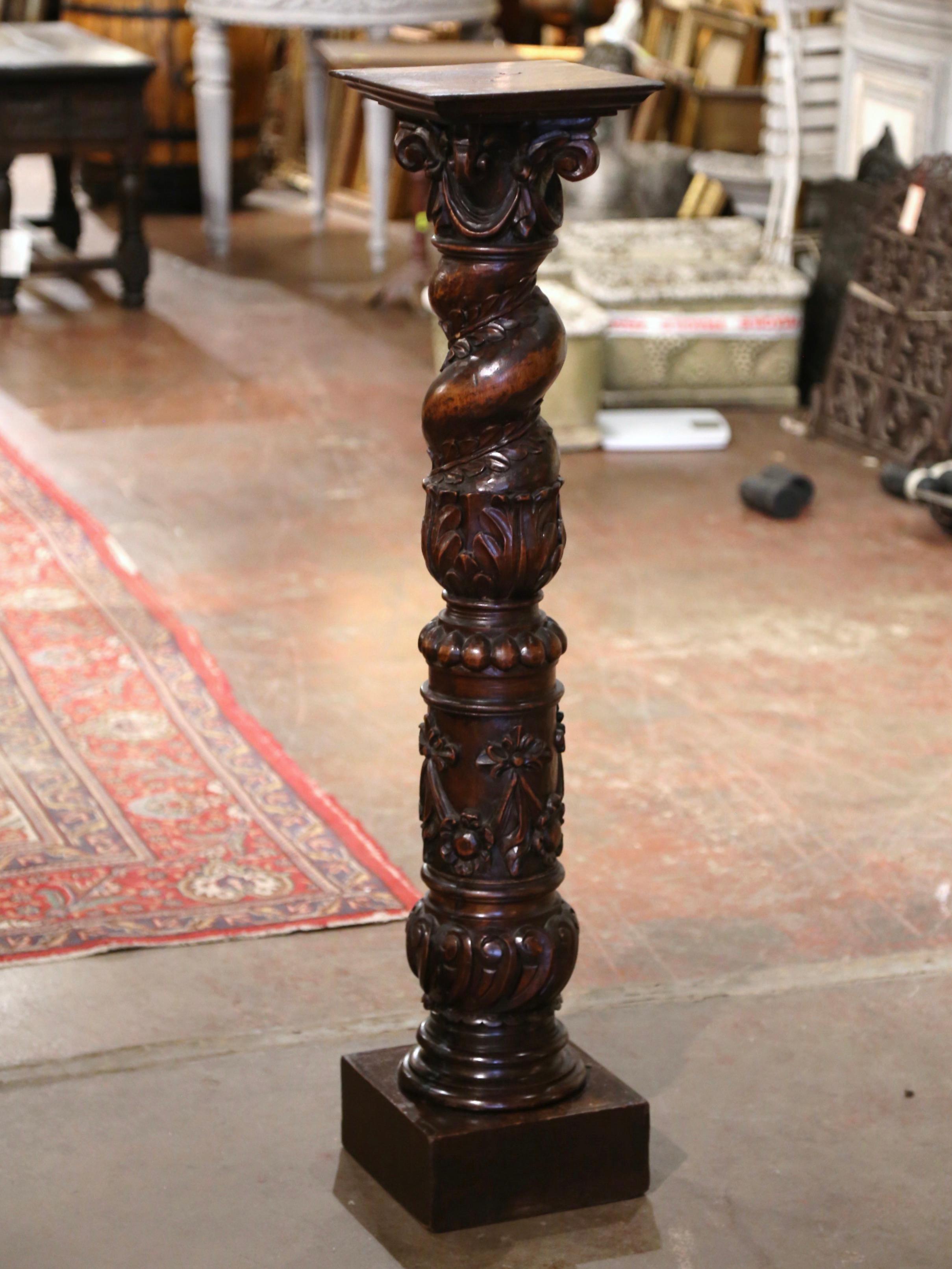 This elegant antique pedestal was crafted in the Burgundy region of France, circa 1870. Built of walnut, the tall column stands on a square plinth base over a circular, barley twist and turned stem, decorated with hand carved laurel leaf, foliage,