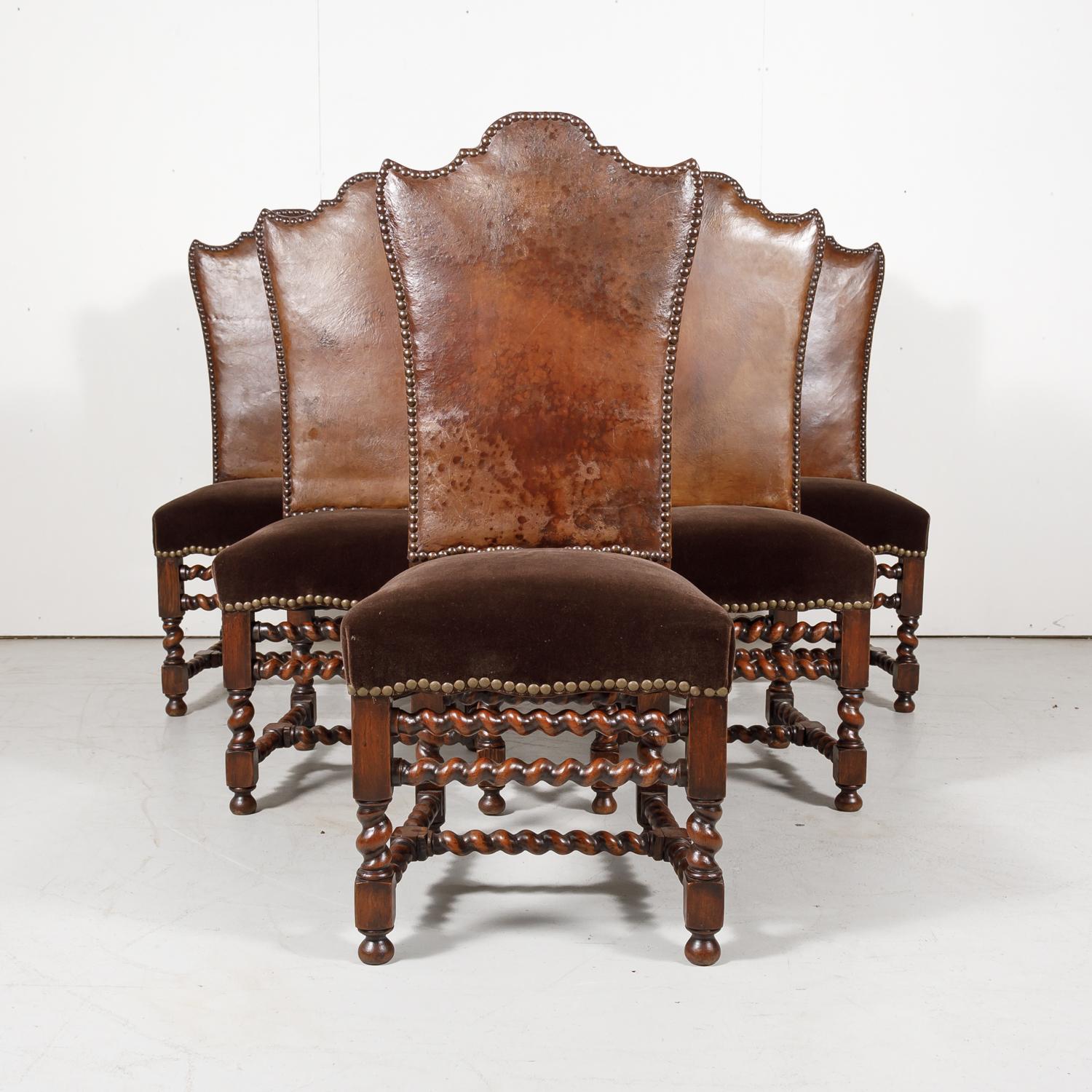 A beautiful set of six antique high back French Louis XIII style barley twist side chairs handcrafted and carved of old growth French oak by talented artisans in Bordeaux, having the original leather backs and newly upholstered mohair seats with