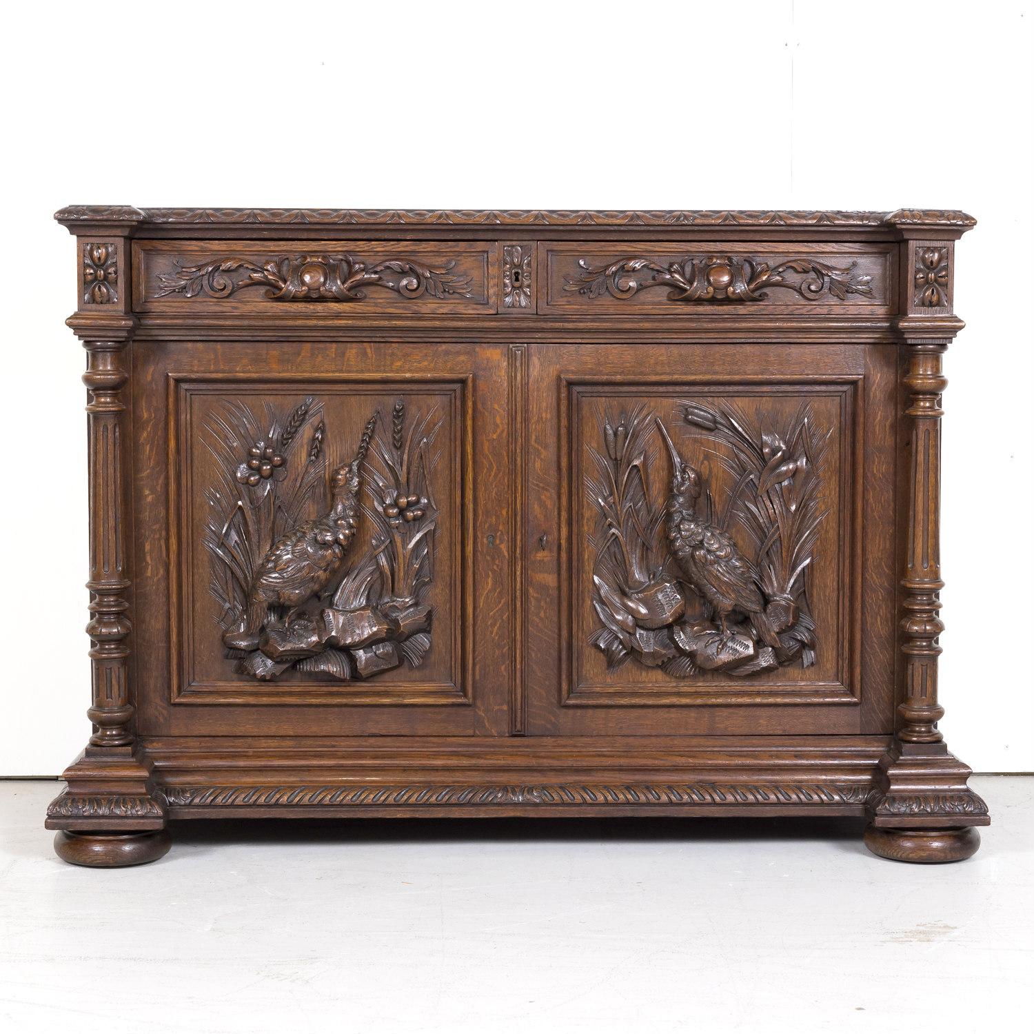 Exceptional 19th century Louis XIII style buffet de chasse or hunt buffet handcrafted by talented artisans in the Normandy region of old growth French oak, circa 1870s. This handsome French Renaissance buffet features carved gadrooning on the top