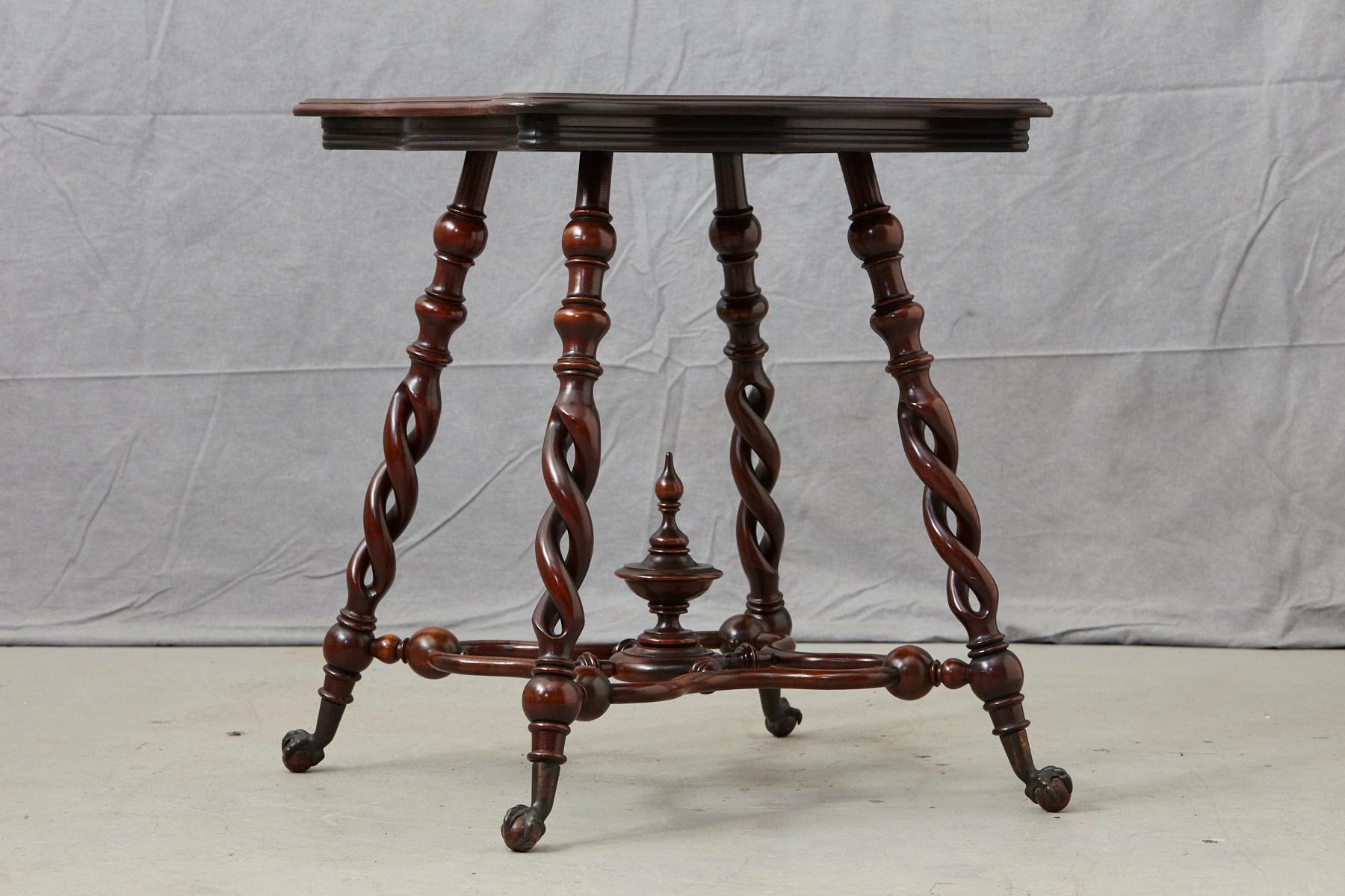 19th century French Louis XIII style square walnut side table raised on four exquisite barley twist legs. Detailed, carved stretchers with urn-shaped carved finial and brass ball and claw feet.
  