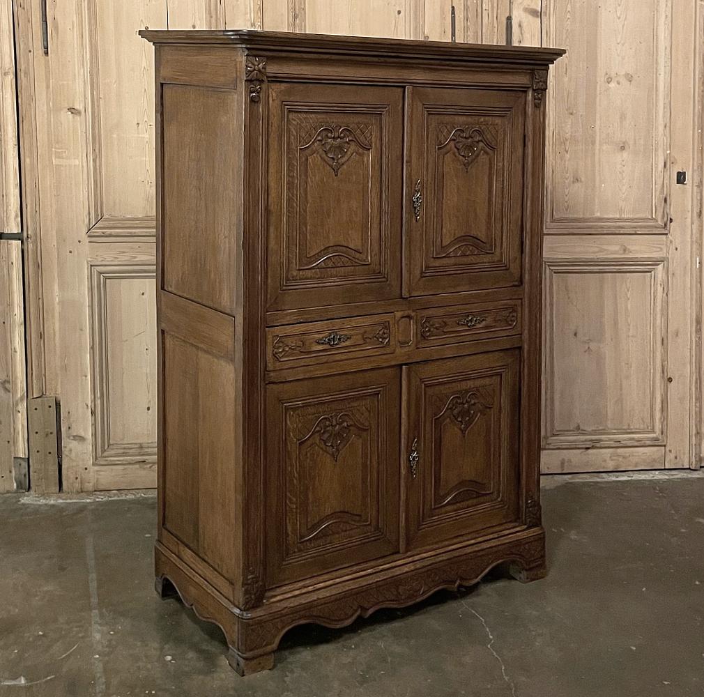 19th century French Louis XIV cabinet ~ Homme Debout is a great choice for a cozy room, or even as an accent piece in a larger room! Four doors provide unfettered access to the upper and lower cabinet, with two drawers separating the cabinets for