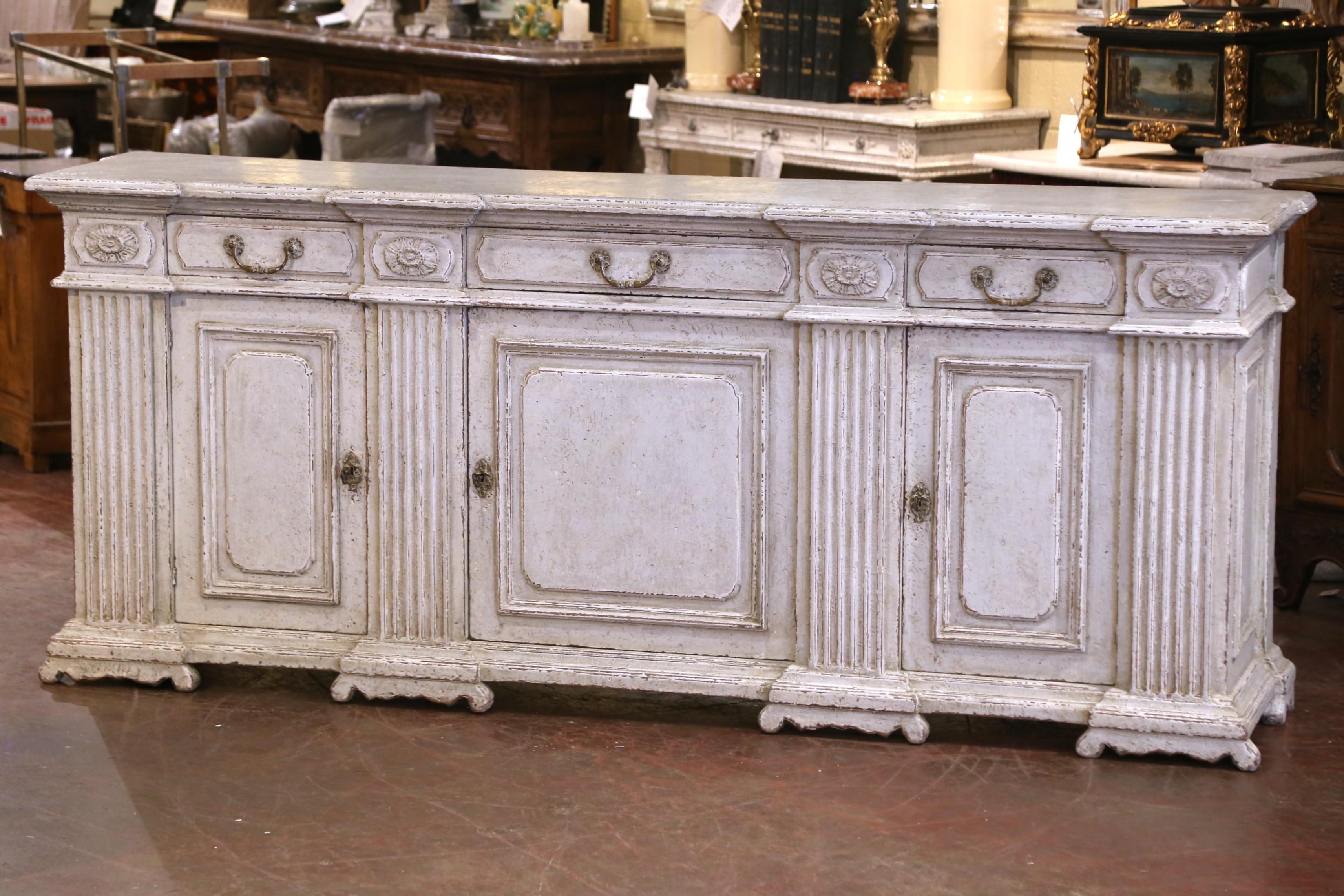Impressive in both scale and presence, this 19th-century French enfilade  captures the grandeur and architectural symmetry of the Louis XIV style. Crafted in France circa 1860 from solid oak, the buffet features a beautifully layered and distressed