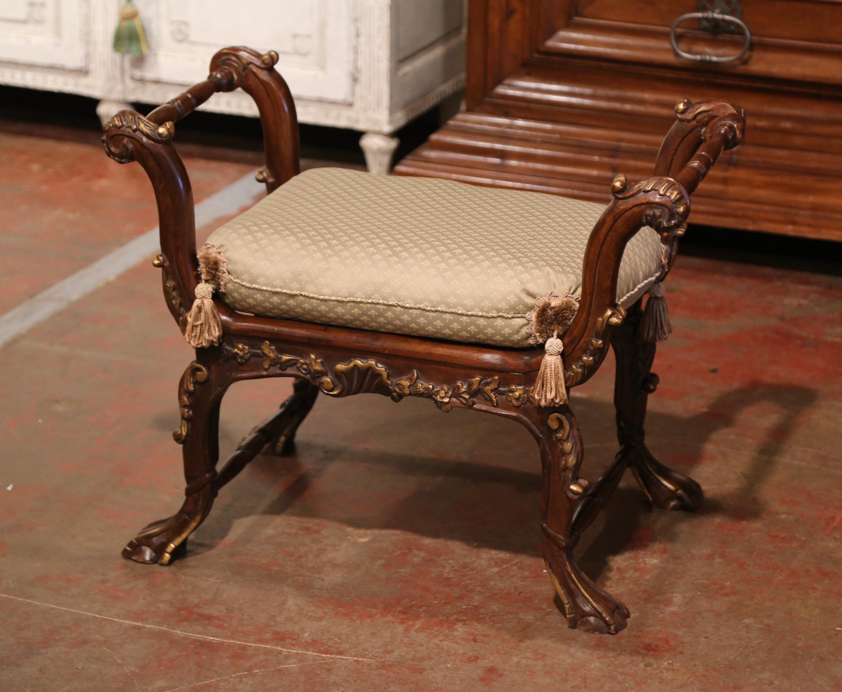 This elegant fruit wood bench was crafted in southern France, circa 1880. The antique chair stands on cabriole legs decorated with acanthus leaf motifs at the shoulder, and ending with claw feet. The scalloped apron is embellished with carved floral