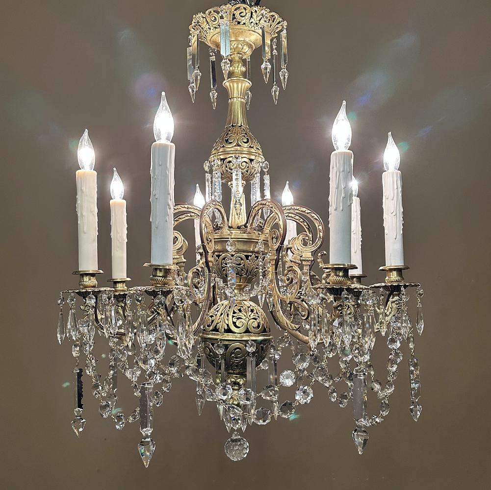 19th Century French Louis XIV Cast Bronze and Cut Crystal Chandelier is a magnificent work of the metal smith's art!  Amazing detail abounds from the crown to the faceted crystal ball at the bottom.  On the crown, we see a scrollwork and foliate