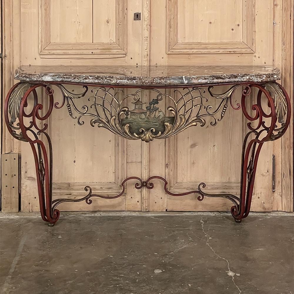 19th century French Louis XIV Chinoiserie wrought iron & marble console is a marvel of the furniture maker's art! The bold scrollwork of the design immediately captivates one's attentions upon entering the room, then the subtle coloration of the