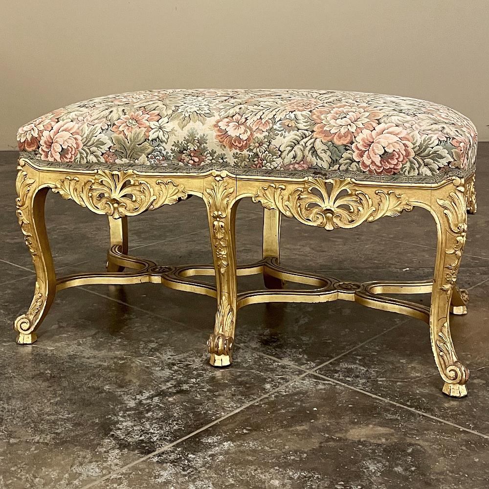 19th Century French Louis XIV Giltwood Vanity Bench with Tapestry is a special find, indeed!  Sculpted in the bold scrollwork and prominent carved embellishment made popular during the reign of the Sun King, it features six elegantly scrolled and