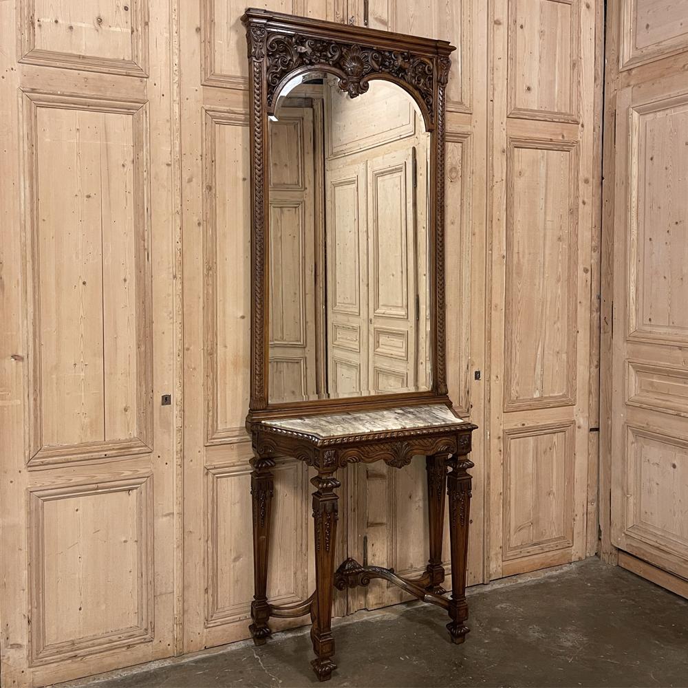 19th Century French Louis XIV marble top console with mirror is a magnificent collaboration between expert and talented artisans from three disciplines! First, the cabinetmaker created the table and mirror frame from sumptuous select French walnut.
