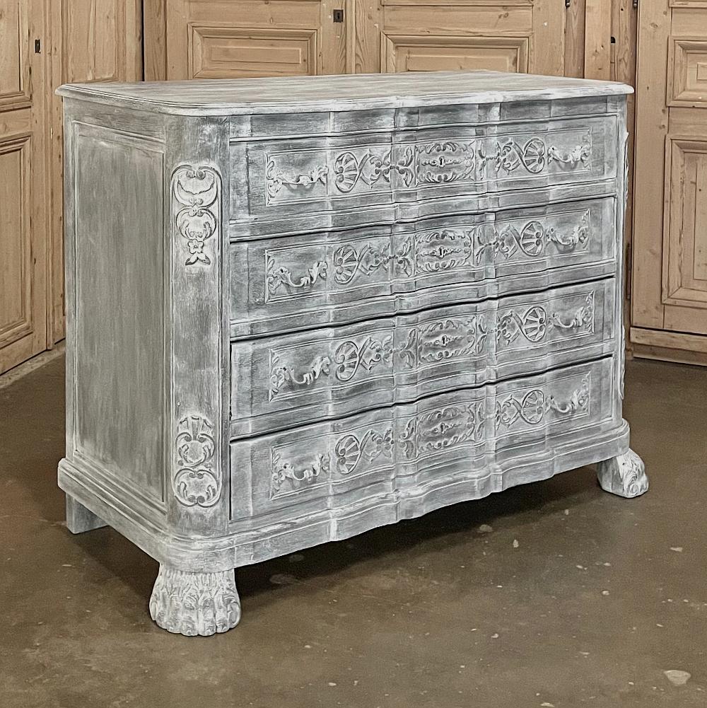 19th century French Louis XIV painted commode is as functional as it is visually appealing! The wonderfully contoured facade embraces four spacious drawers that are fitted with brass pulls and carved with stylized foliate motifs. The rounded