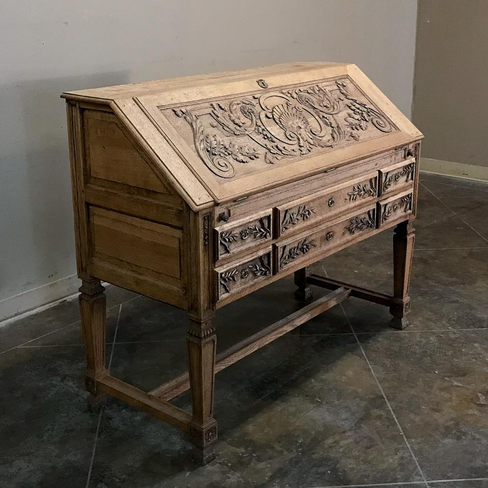 19th century French Louis XIV stripped oak secretary is a marvel of craftsmanship ~ rendered in solid oak to last for generations! Wider than most secretaries of its type, it is more than adequate to accommodate a 21st century mobile office.
