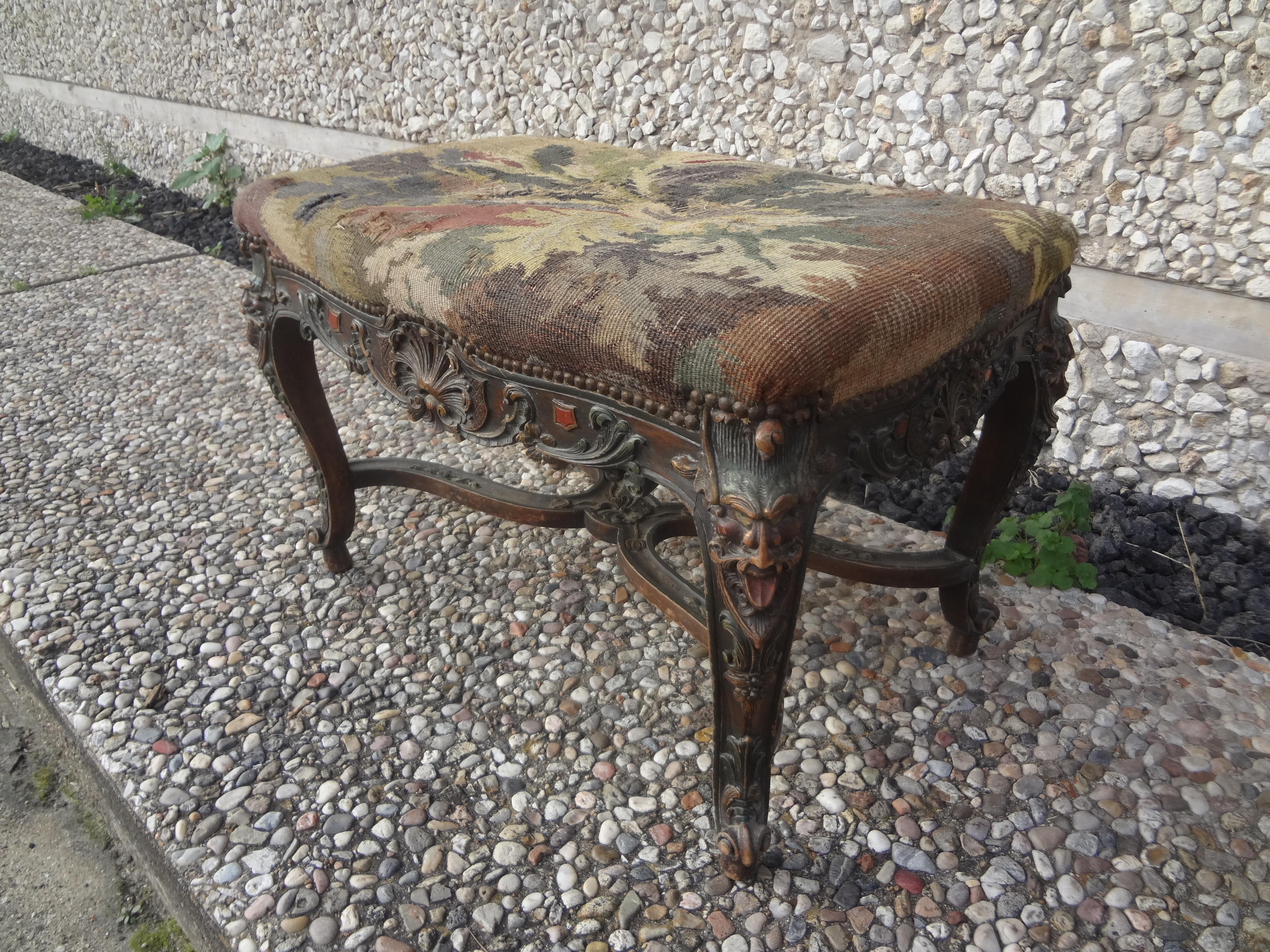 19th Century French Louis XIV Style Bench.
Our mid 19th century French Louis XIV style bench has beautifully carved legs connected by a lovely stretcher decorated with grotesque masks at each corner.
Our bench was acquired with antique tapestry