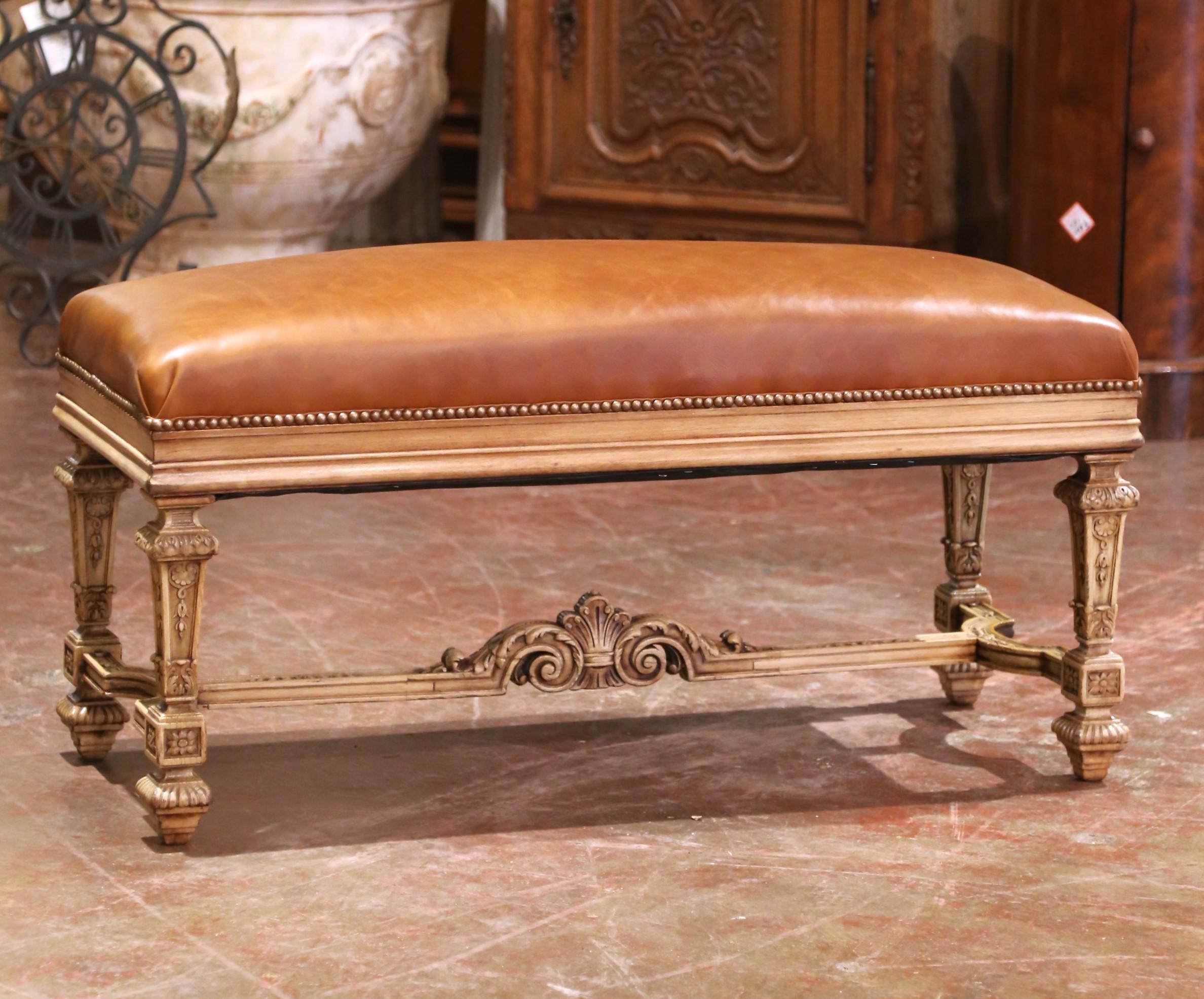 This elegant 19th-century French bench, crafted circa 1870 in the Louis XIV style, brings refined craftsmanship and rich texture to any interior. The solid oak frame has been bleached to a soft, natural finish that highlights its intricate carvings,