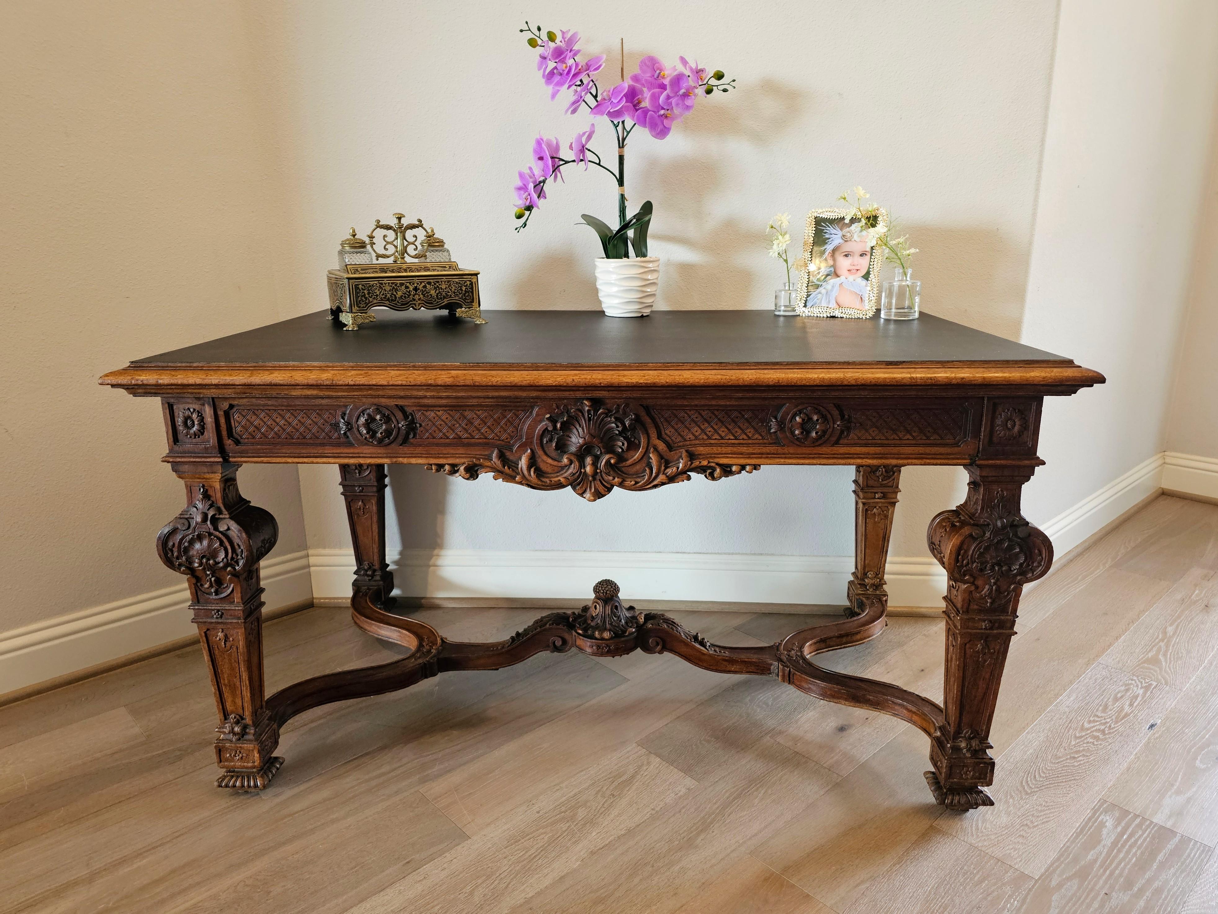 A finely carved French Louis XIV style walnut writing table. circa 1870

Hand carved in France in the late 19th century, exceptionally executed in grand King Louis 14th taste, hand-crafted out of solid walnut, high-quality craftsmanship and