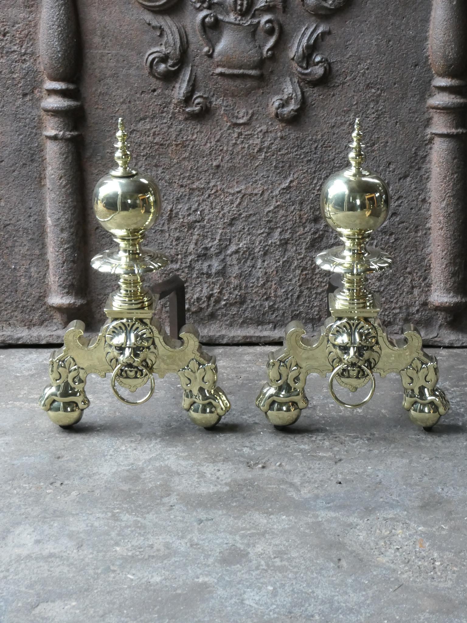 19th century French Louis XIV style andirons made of polished brass and wrought iron. The condition is good. The andirons are fit for use in the fireplace.








