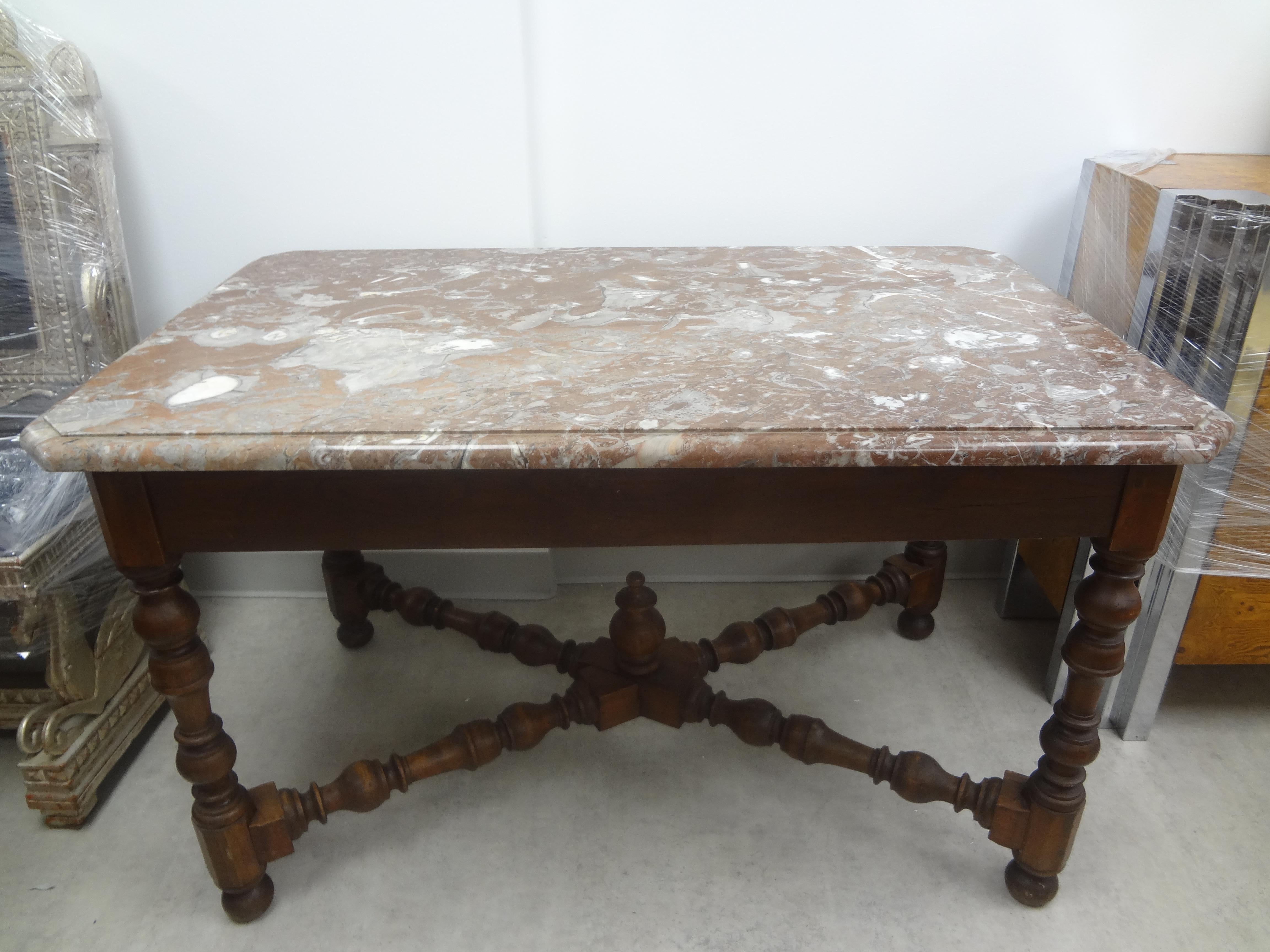 19th century French Louis XIV style walnut center table.
Handsome 19th century French Louis XIII-Louis XIV style walnut center table with the original marble top. This beautiful and versatile antique French table can be used as a centre table, side