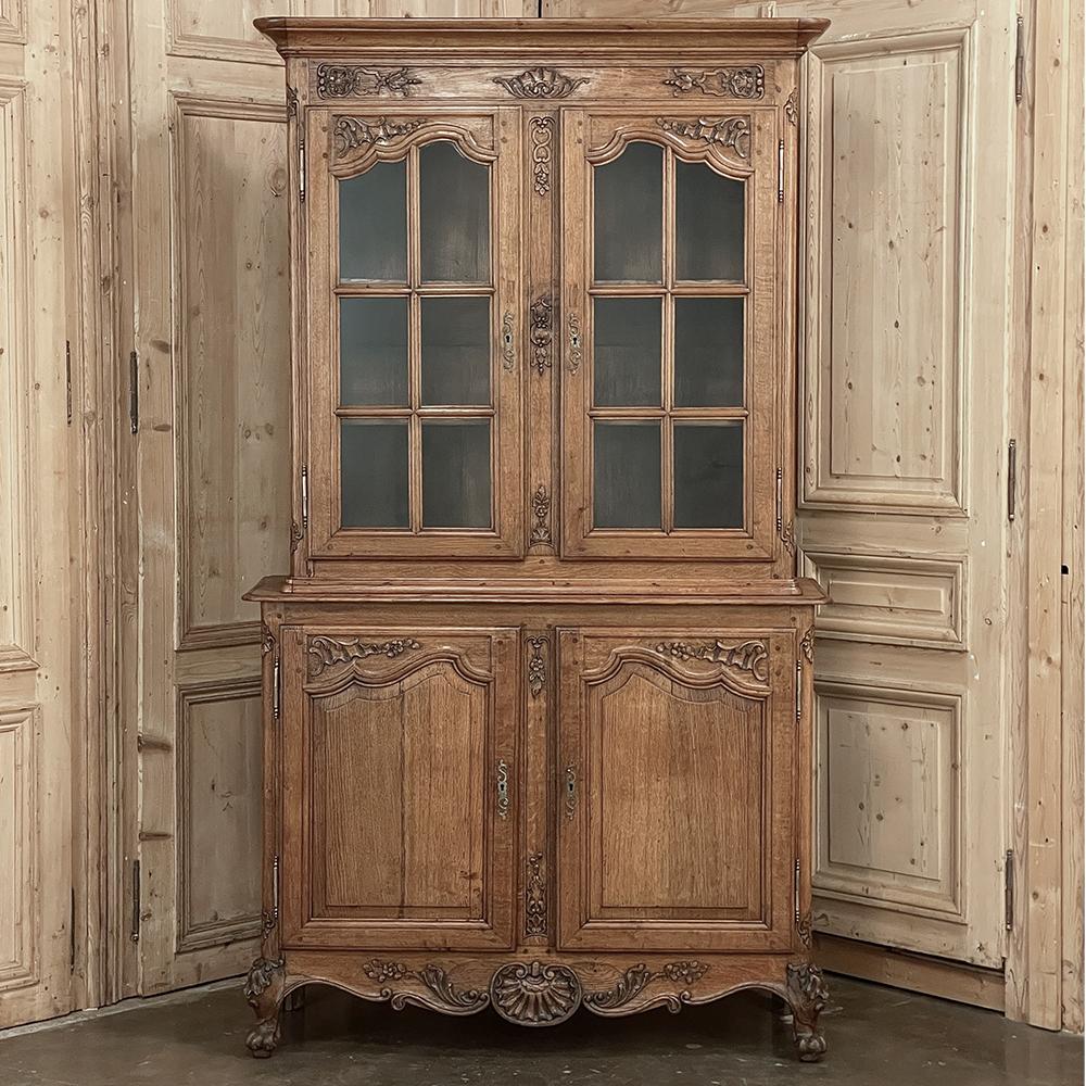 19th century French Louis XIV Two-Tiered Bookcase ~ China Buffet is a magnificent example of fine furniture craftsmanship melded with timeless style! Utilizing hand-select quarter-sawn oak, the artisans created a rectilinear two tiered architecture