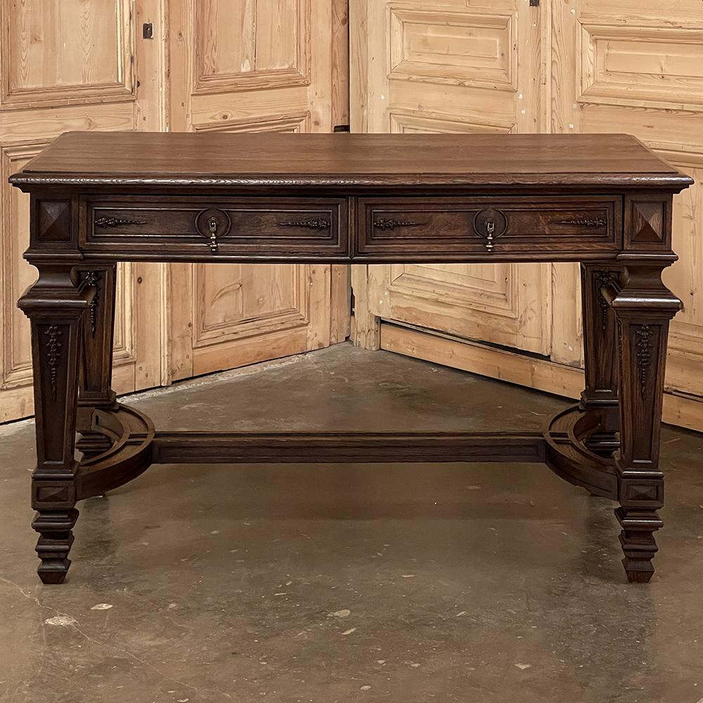 19th Century French Louis XIV writing table ~ desk is a handsome piece that is perfect for adding a little elegance to your room while providing a very useful surface with storage. Hand-crafted from solid old-growth oak, it features a simple plank