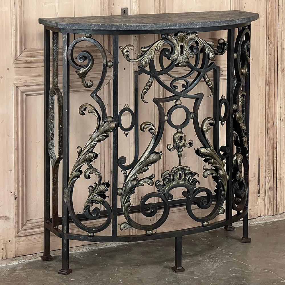 19th Century French Louis XIV Wrought Iron Demilune Console with Black Marble dates to the Napoleon III period and recalls the splendor of the age! Elegant and complex scrolls weave their way across the curved facade, and are embellished with