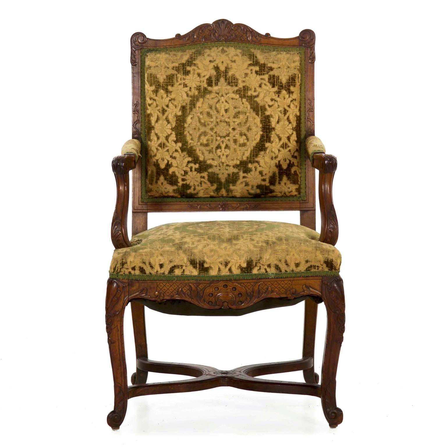 A fine chair with a crisp carved surface that retains an old finish in the rich patinated walnut wood throughout, this was crafted during the second half of the 19th century and has a delightful glow where handling has burnished the finish into a