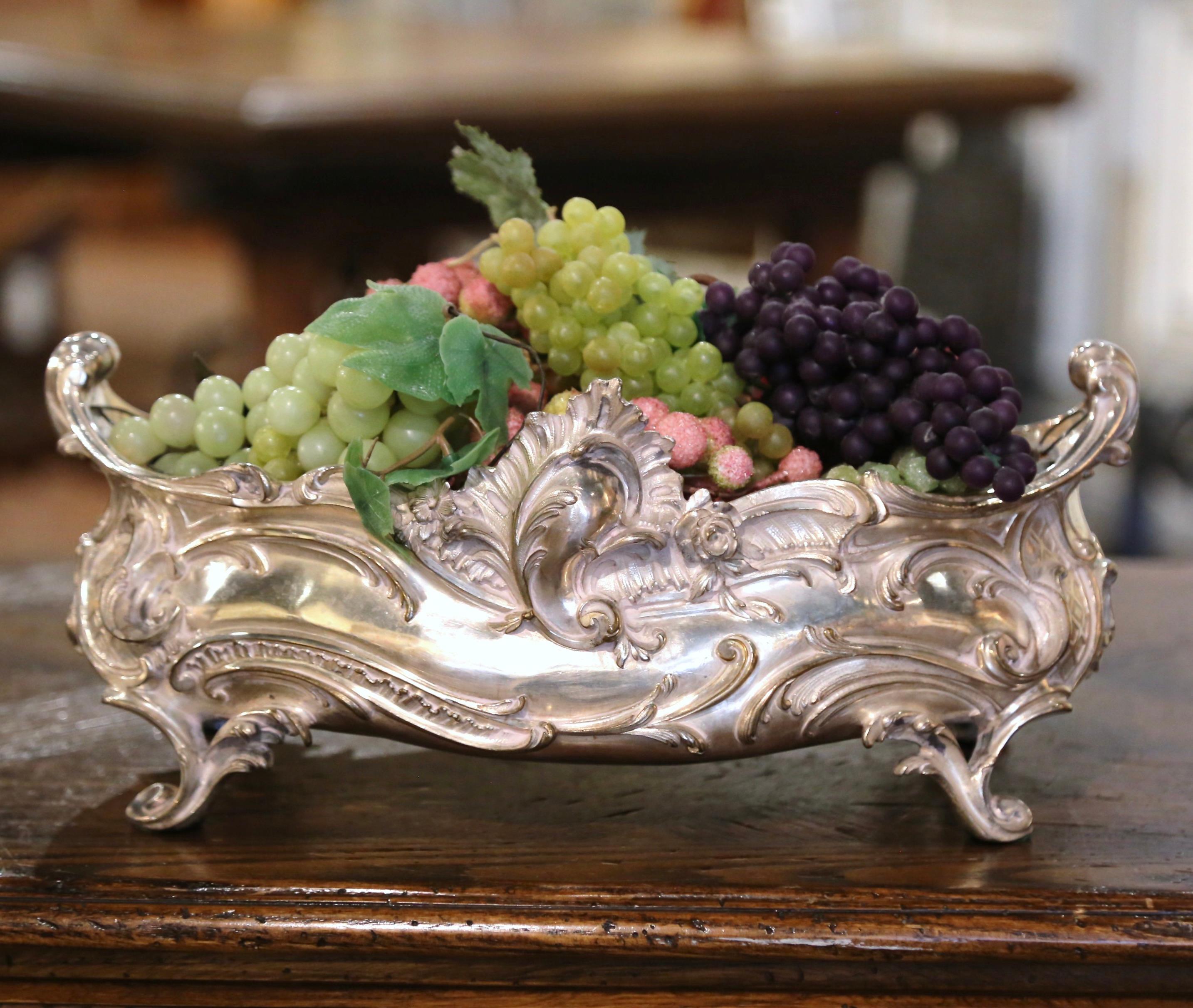 This elegant bronze silver plated jardinière was created in Paris, France, circa 1870. The oblong antique planter sits on small curved feet and leaves, over a scalloped apron decorated with acanthus leaf motifs; it is further embellished with a