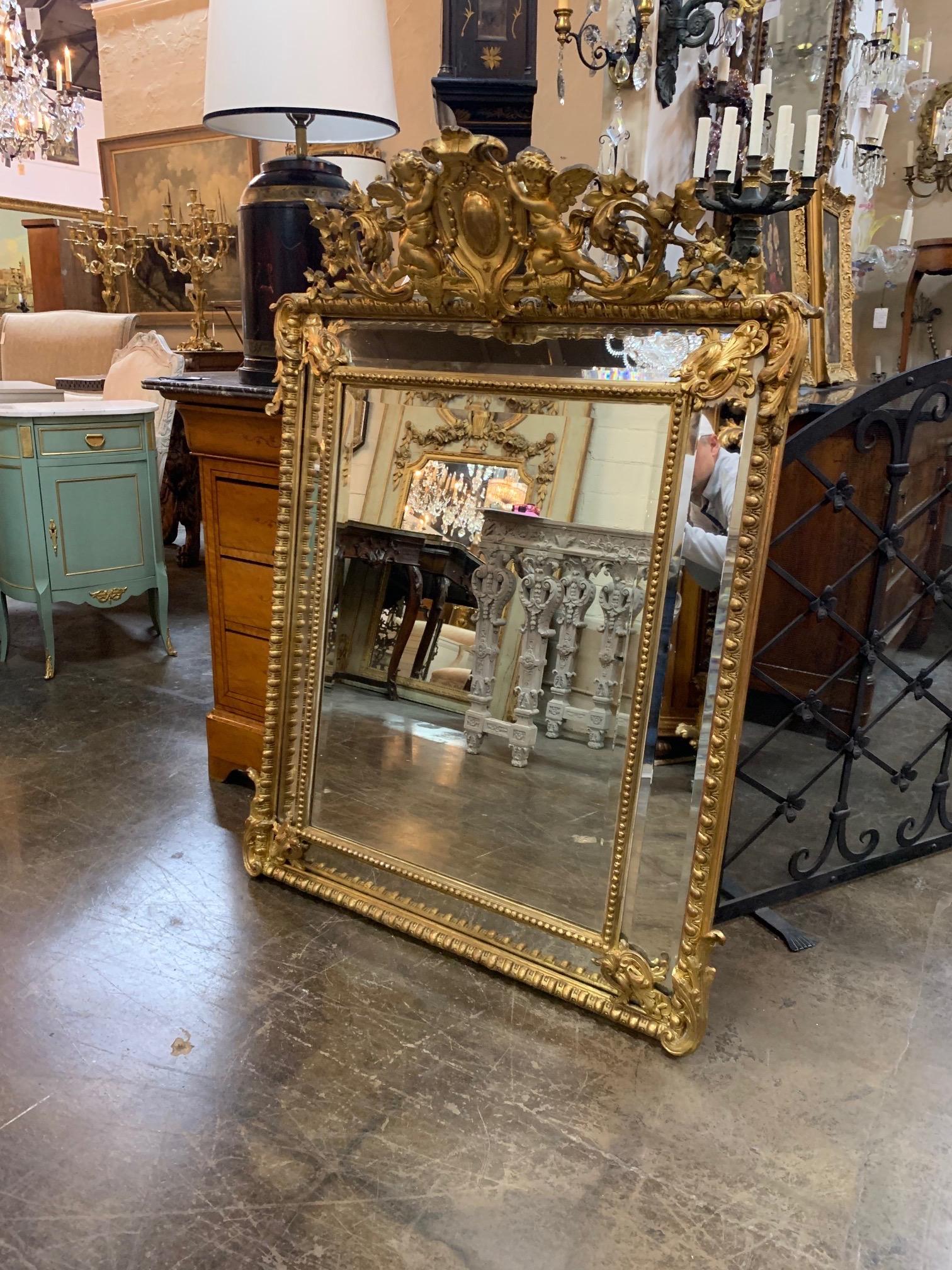 Stunning 19th century French Louis XV carved giltwood cushion mirror. Elaborate carving including a large crown and 2 cherubs. A true work of art!!