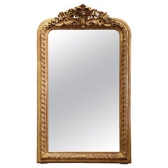 Miroir français du 19ème siècle en bois doré sculpté de style Louis XV avec motifs floraux et feuillus
