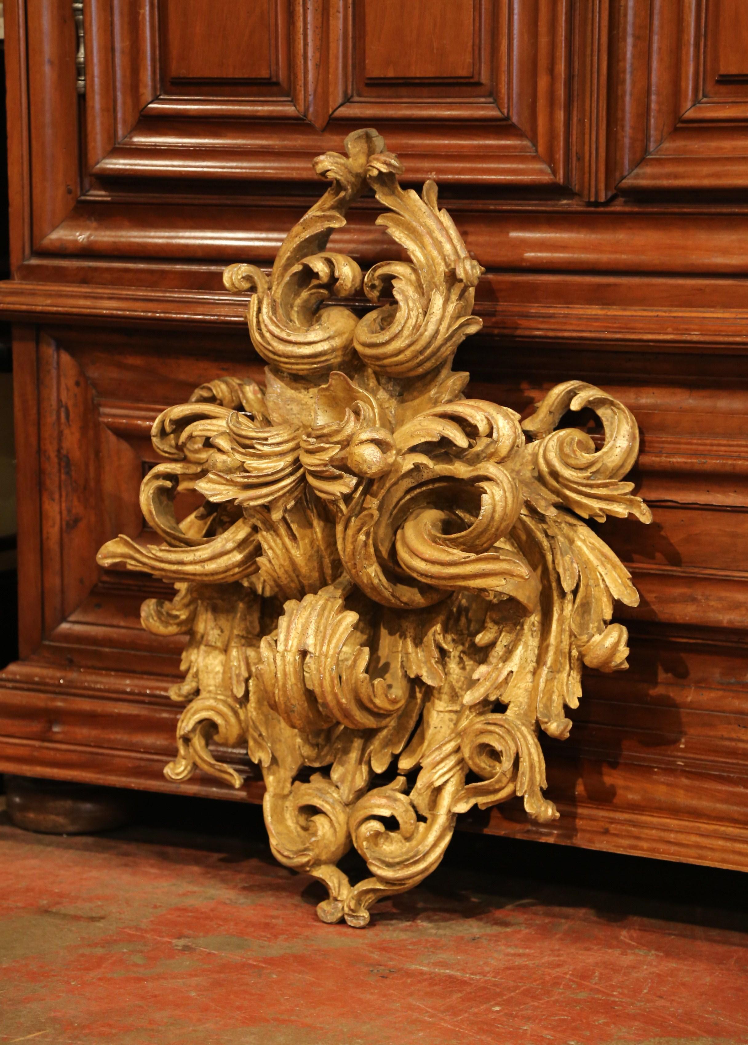 Embellish a mantel with this important antique wood carving sculpture. Crafted in France, circa 1870, the elegant wall-mounted plaque features exquisite carved scrolls embellished with acanthus leaf decor. The large ornament is in excellent