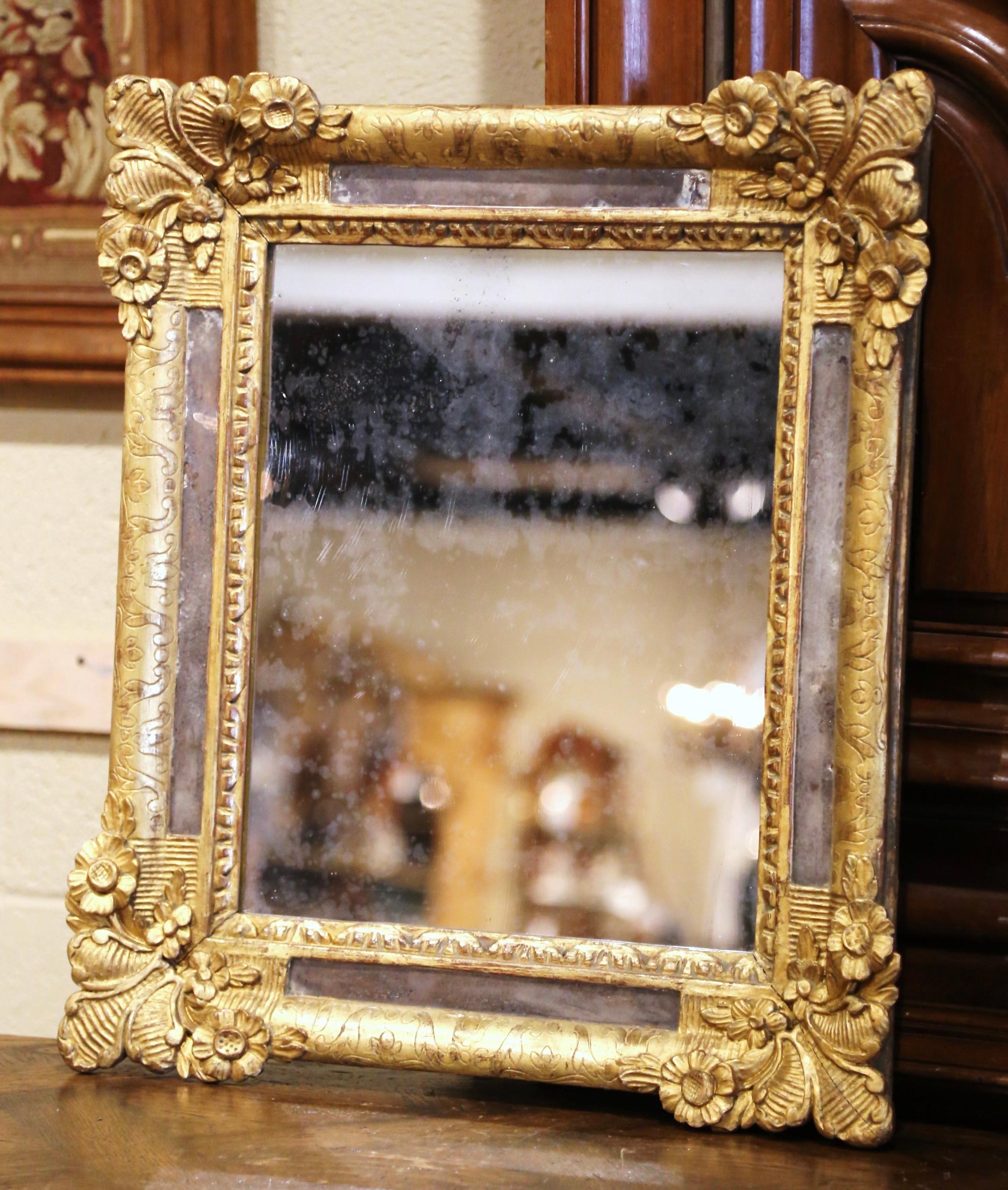 Decorate a powder room or hallway with this elegant antique gilt overlay mirror. Crafted in Provence, Southern France circa 1860, the “Parclose” mirror features nicely carved floral and shell decor in high relief on each corner. The lovely frame is