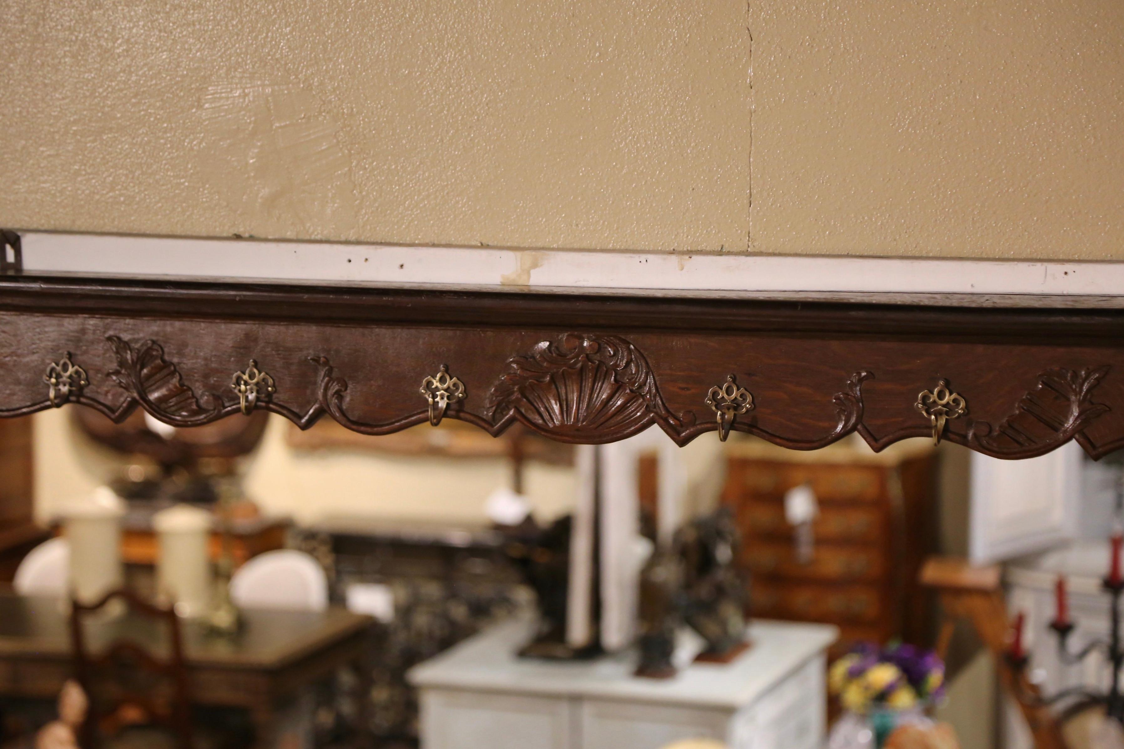 Patinated 19th Century French Louis XV Carved Oak Wall Hanging Shelf from Normandy For Sale