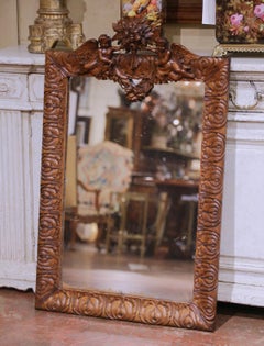 19th Century French Louis XV Carved Oak Wall Mirror with Cherub and Floral Decor